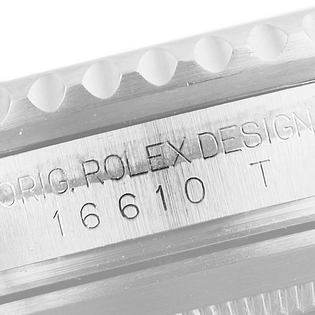 Close-up view of the side of a Rolex Submariner 16610 Men's Stainless Steel Black Dial 16610 Men's Stainless Steel Black Dial watch, showing the model number 16610 and part of the bezel.