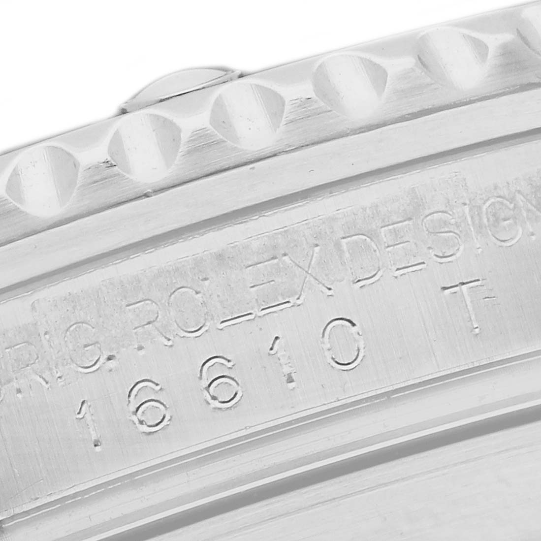 The image shows a close-up of the engraved side with details of the Rolex Submariner 16610 Men
s Stainless Steel Black Dial 16610 Men
s Stainless Steel Black Dial model.