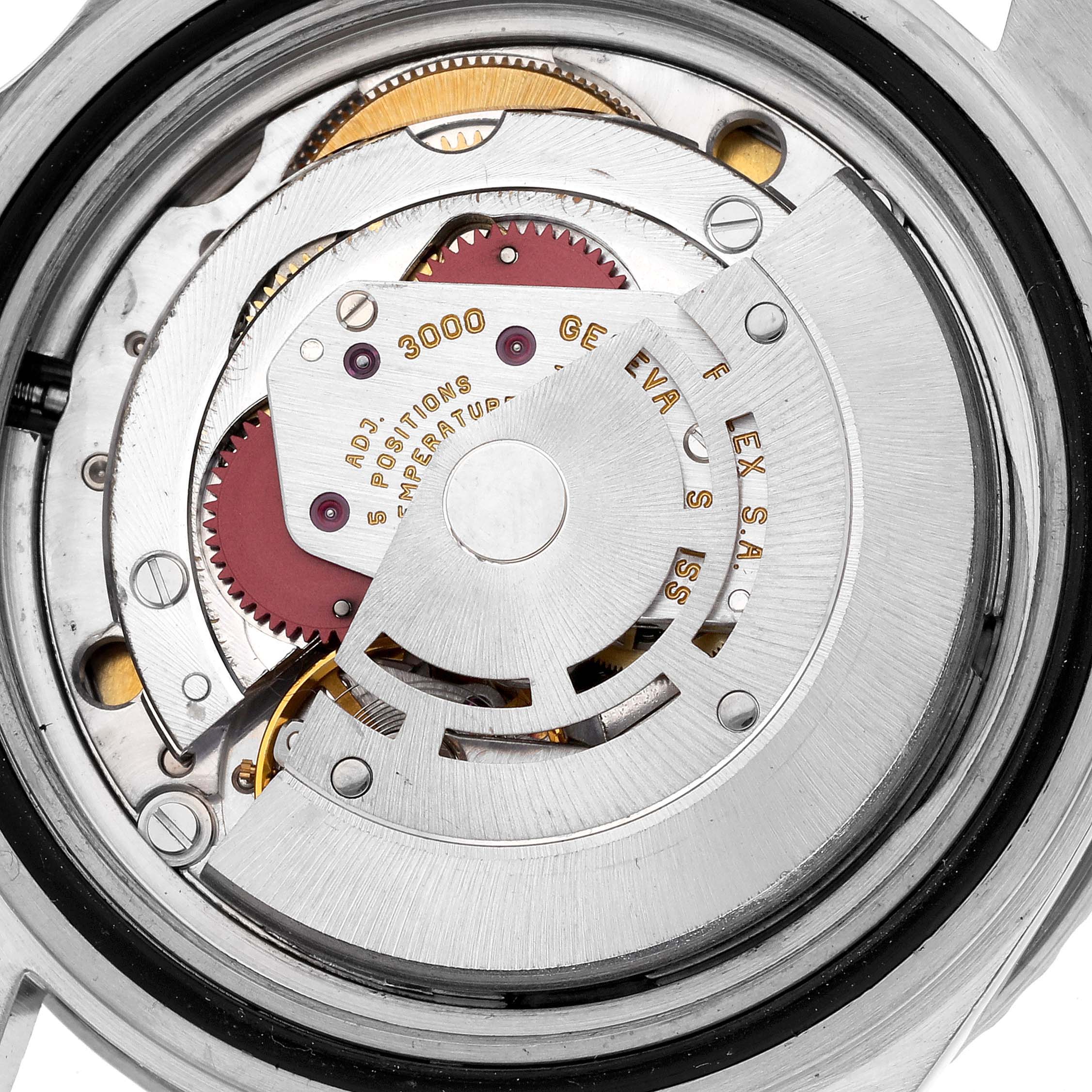 The image shows the internal movement of a Rolex Submariner 14060 Men's Stainless Steel Black Dial 14060 Men's Stainless Steel Black Dial, viewed from the back, highlighting the rotor and gears.