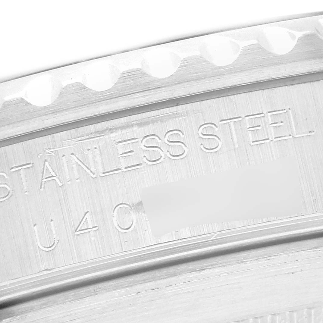 The image shows a close-up of the engraved stainless steel case back on a Rolex Submariner 14060 Men's Stainless Steel Black Dial 14060 Men's Stainless Steel Black Dial.