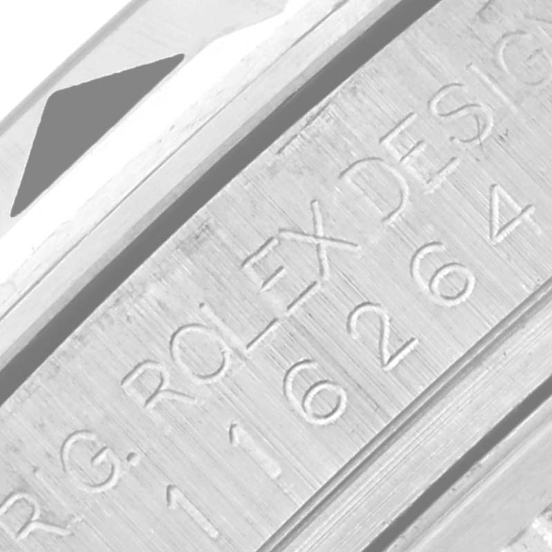 The image shows a close-up of the side engraving on a Rolex Turn-o-Graph 116264 Men
s Stainless Steel White Dial 116264 Men
s Stainless Steel White Dial watch, highlighting the model number.