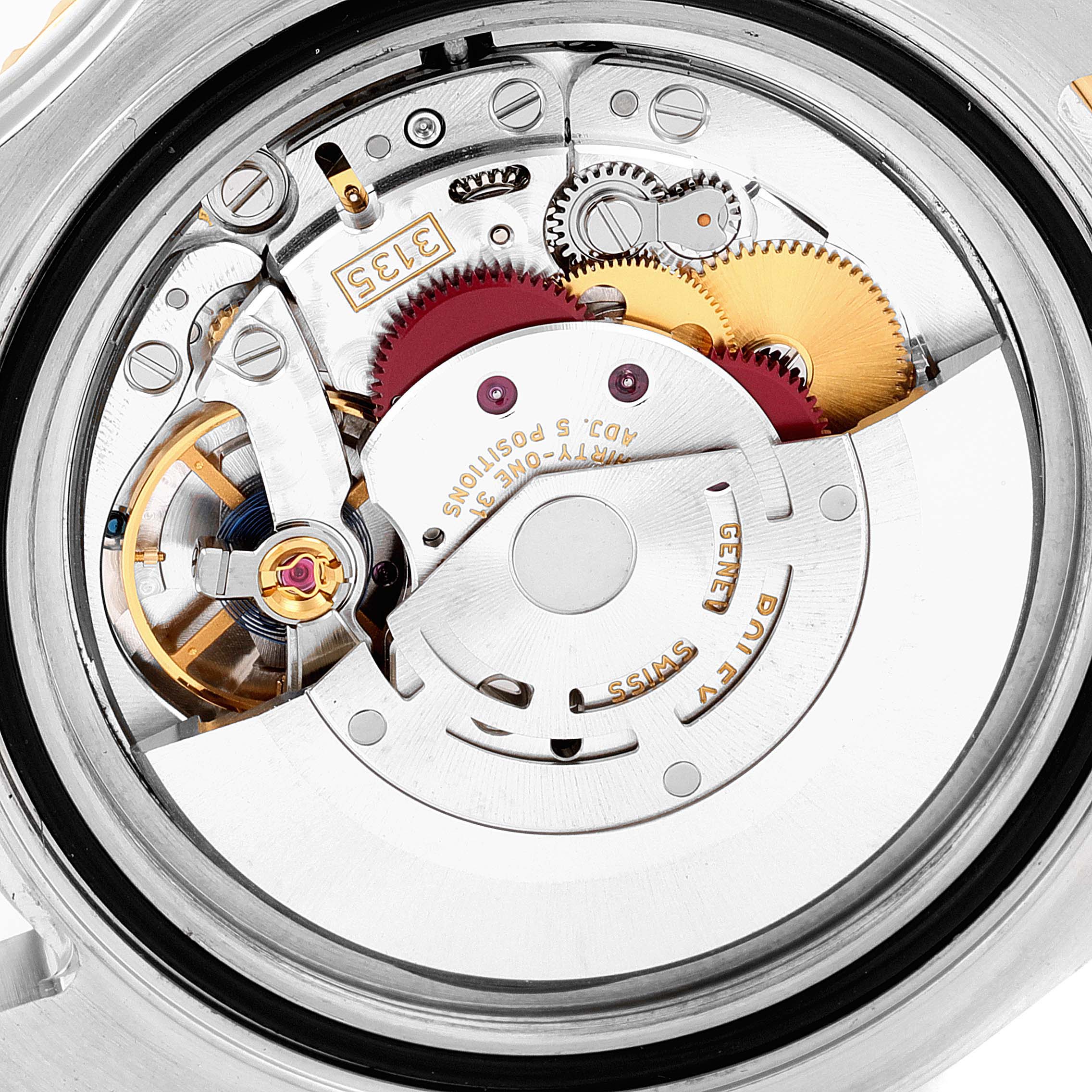 This is a close-up view of the internal mechanical movement of a Rolex Yacht-Master 16623 Men's Steel and Gold (two tone) Mother of Pearl Dial 16623 Men's Steel and Gold (two tone) Mother of Pearl Dial watch, showing gears and components.