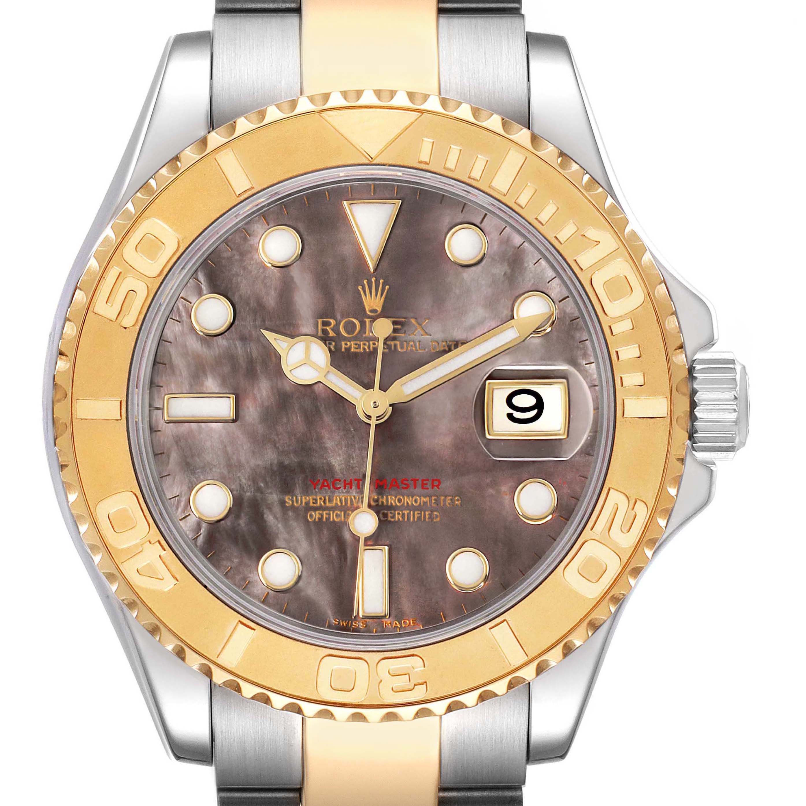 The Rolex Yacht-Master model 16623 is shown from the front, highlighting its gold bezel, mother of pearl dial, and date window.