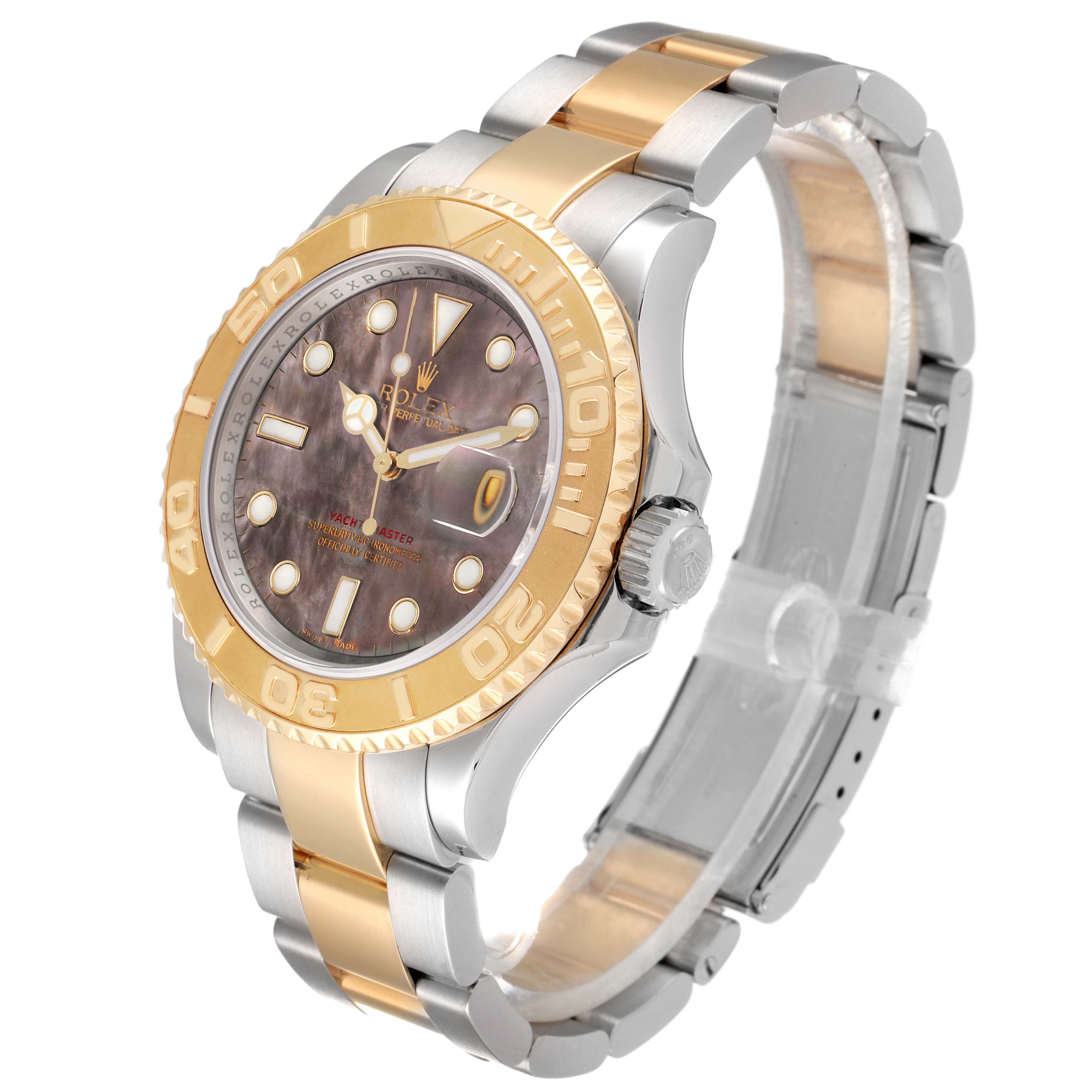 The Rolex Yacht-Master model 16623 is shown at a three-quarter angle, highlighting the watch's face, bezel, crown, and bracelet.