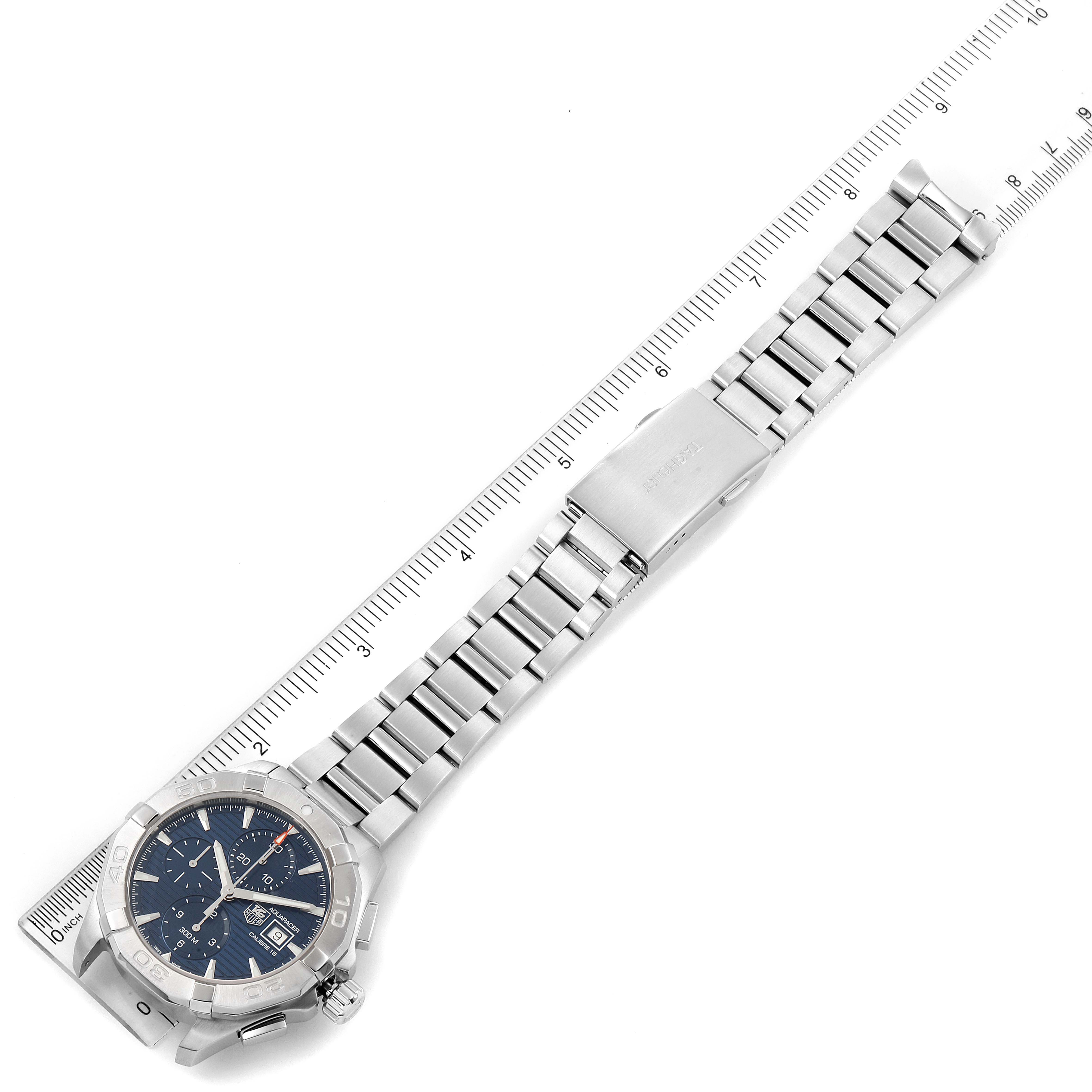 The image shows a Tag Heuer Aquaracer CAY2112.BA0927 Men
s Stainless Steel Blue Dial CAY2112.BA0927 Men
s Stainless Steel Blue Dial watch laid flat with a ruler for measurement.