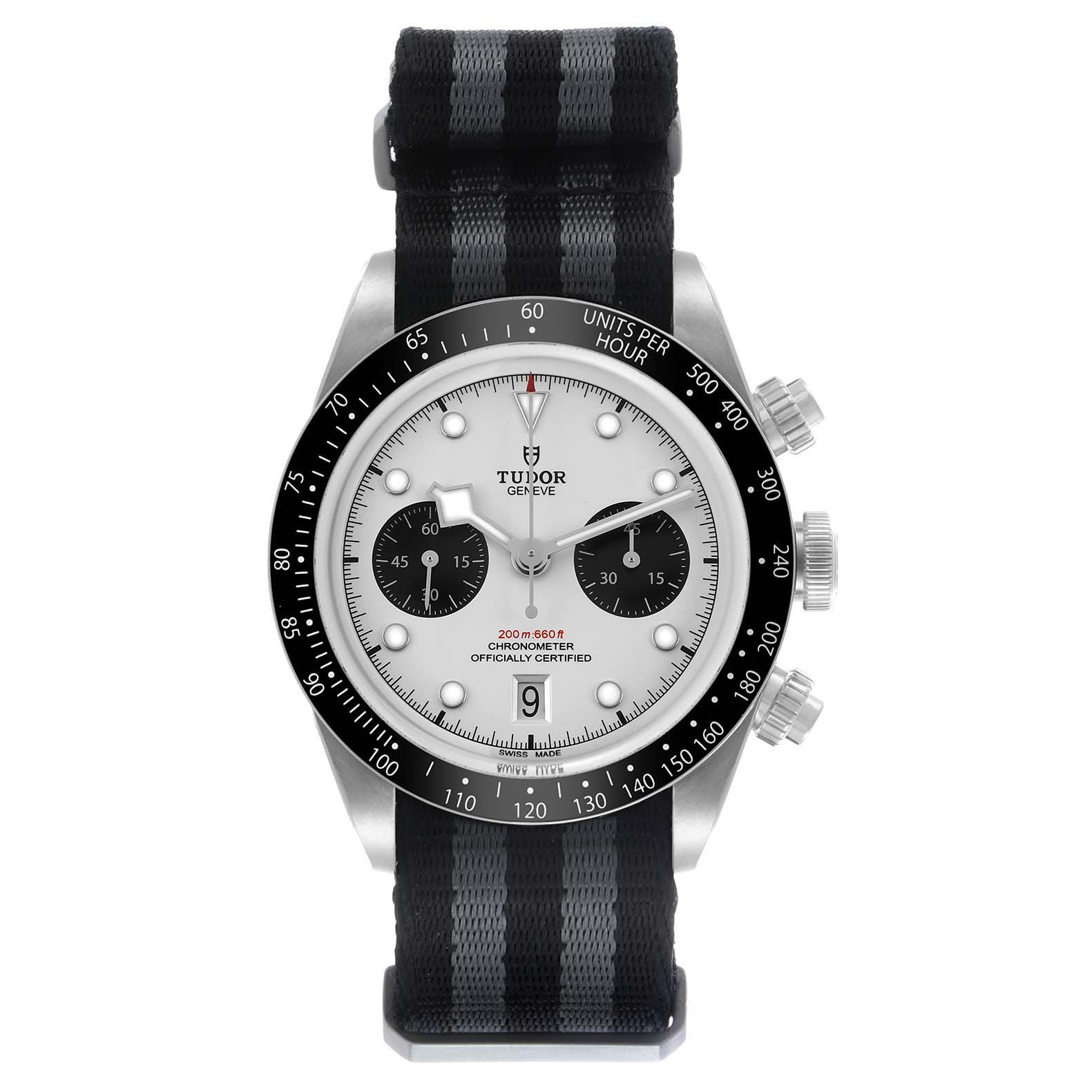 The Tudor Heritage Chrono 79360 Men's Stainless Steel Silver Dial watch is shown from a front angle, highlighting the dial, bezel, buttons, and striped fabric strap.