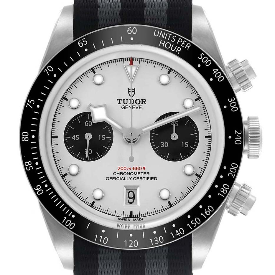 The image shows a frontal view of the Tudor Heritage Chrono 79360 Men's Stainless Steel Silver Dial watch, highlighting the dial, bezel, and pushers.