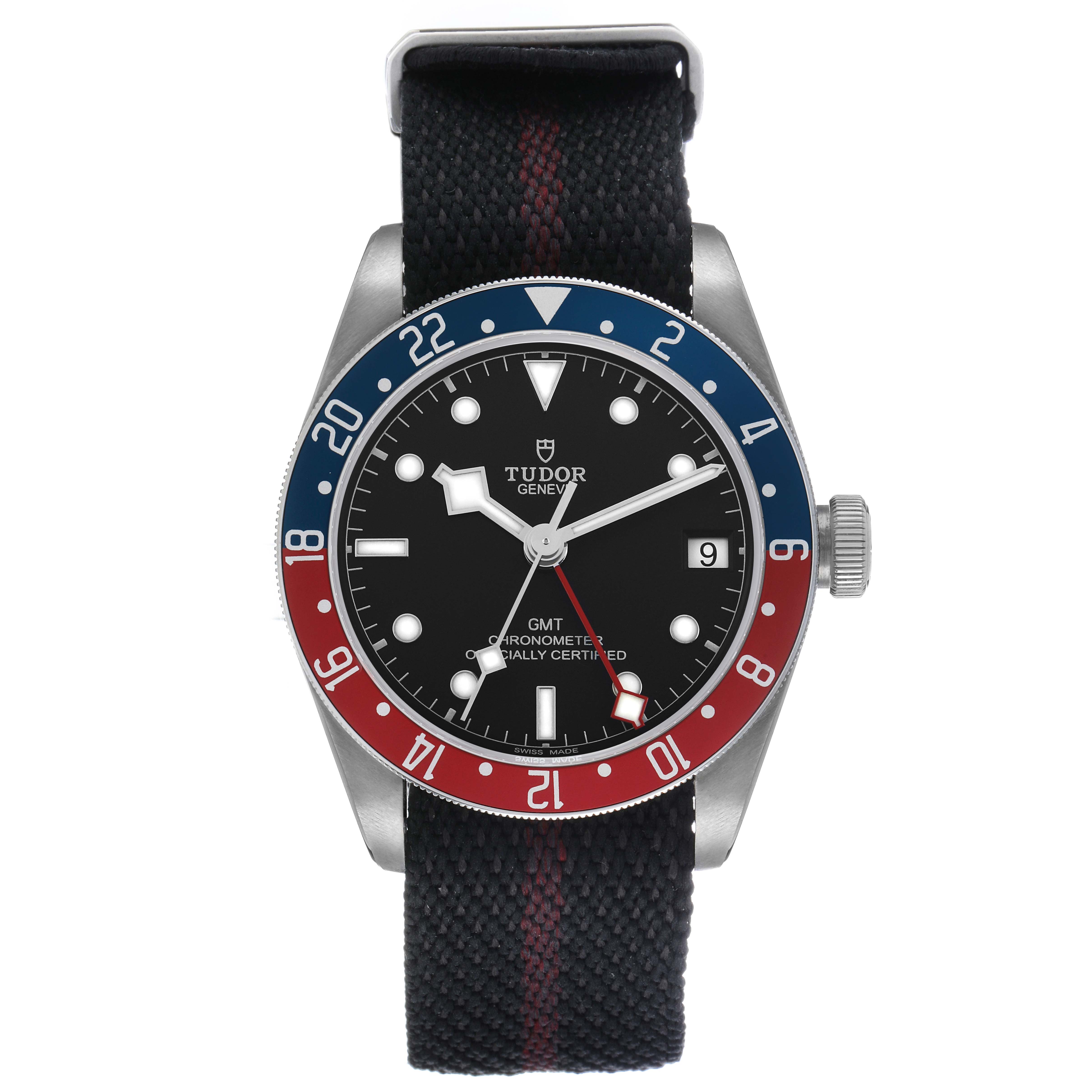 The Tudor Heritage Black Bay 79830RB Men's Stainless Steel Black Dial watch is shown from a frontal angle, highlighting the bezel, dial, and fabric strap.