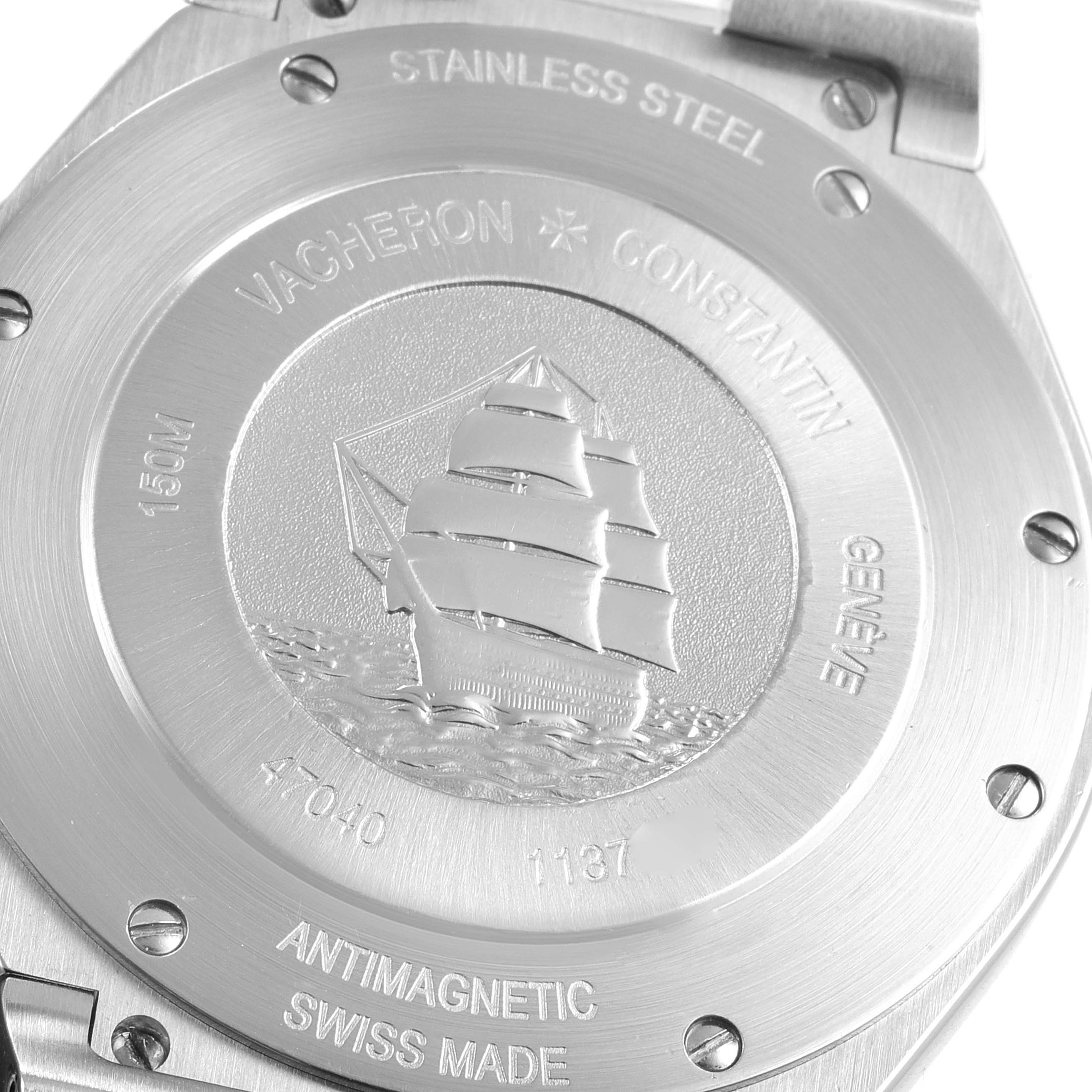 The image shows the stainless steel case back of the Vacheron Constantin Overseas 47040/B01A-9094 Men's Stainless Steel Black Dial 47040/B01A-9094 Men's Stainless Steel Black Dial model, featuring an engraved sailboat and various inscriptions.