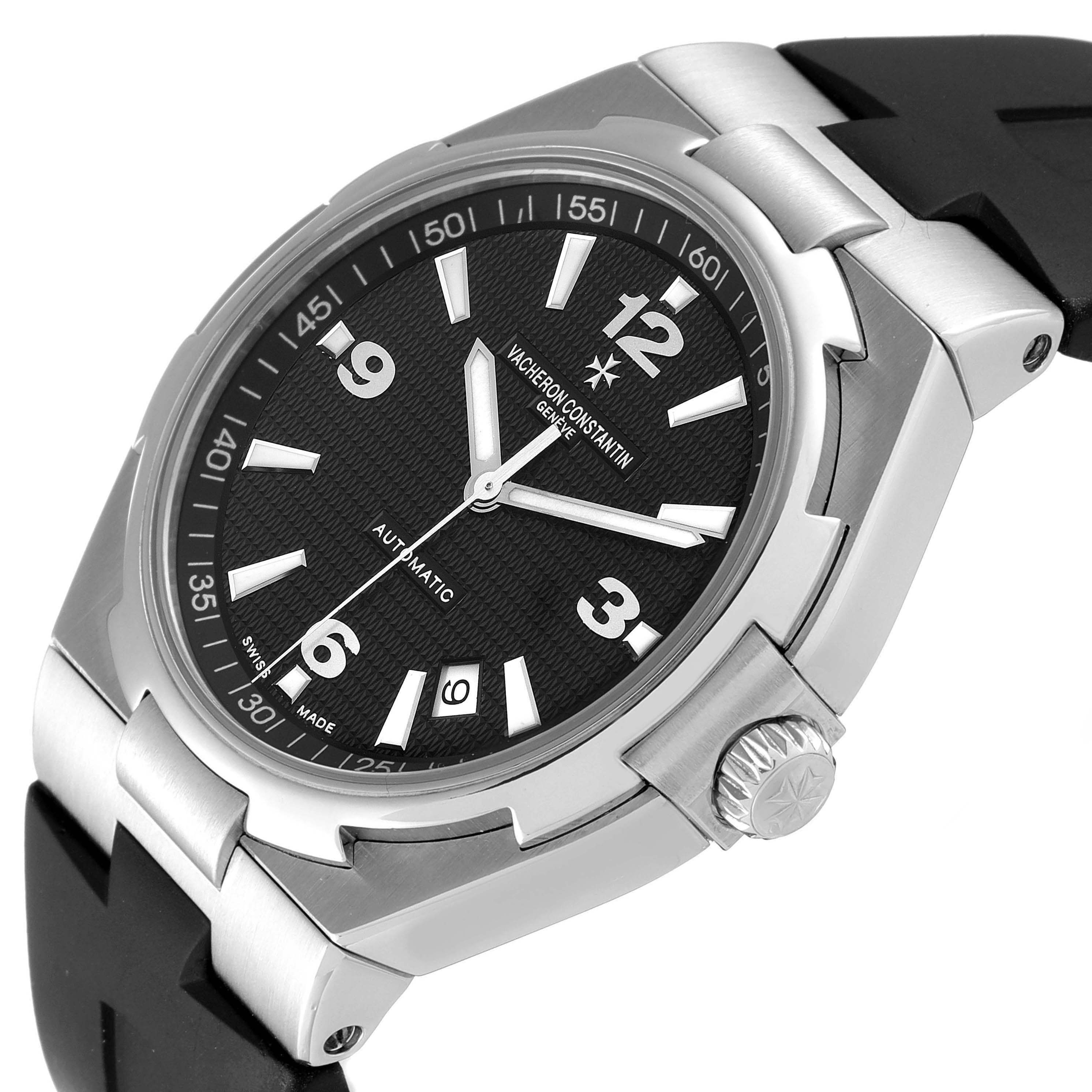 The image shows a Vacheron Constantin Overseas 47040/B01A-9094 Men's Stainless Steel Black Dial 47040/B01A-9094 Men's Stainless Steel Black Dial watch at an angled close-up, highlighting the dial, crown, and part of the rubber strap.