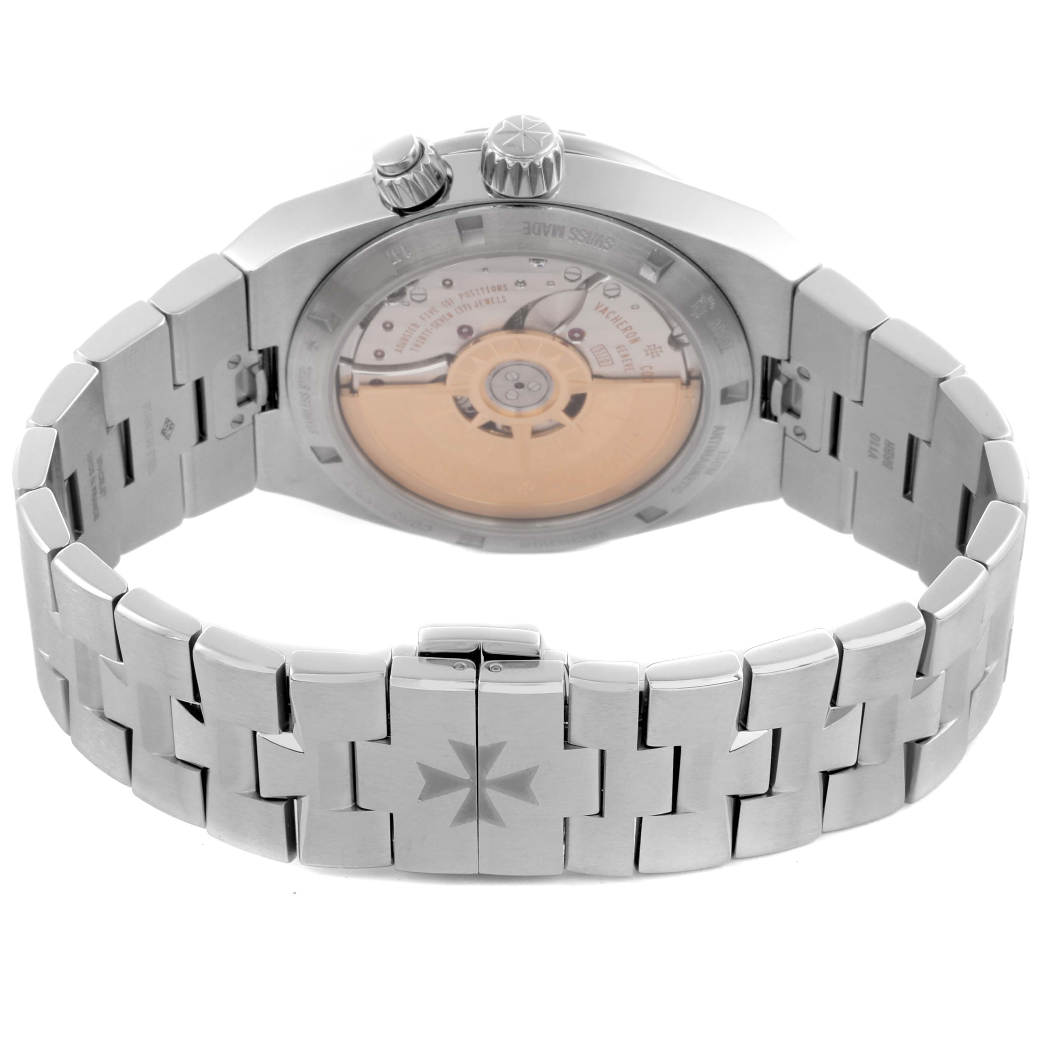 The Vacheron Constantin Overseas 7900V/110A-B333 Men's Stainless Steel Silver Dial 7900V/110A-B333 Men's Stainless Steel Silver Dial watch is shown from the back, highlighting the movement and the bracelet with a Maltese cross clasp.