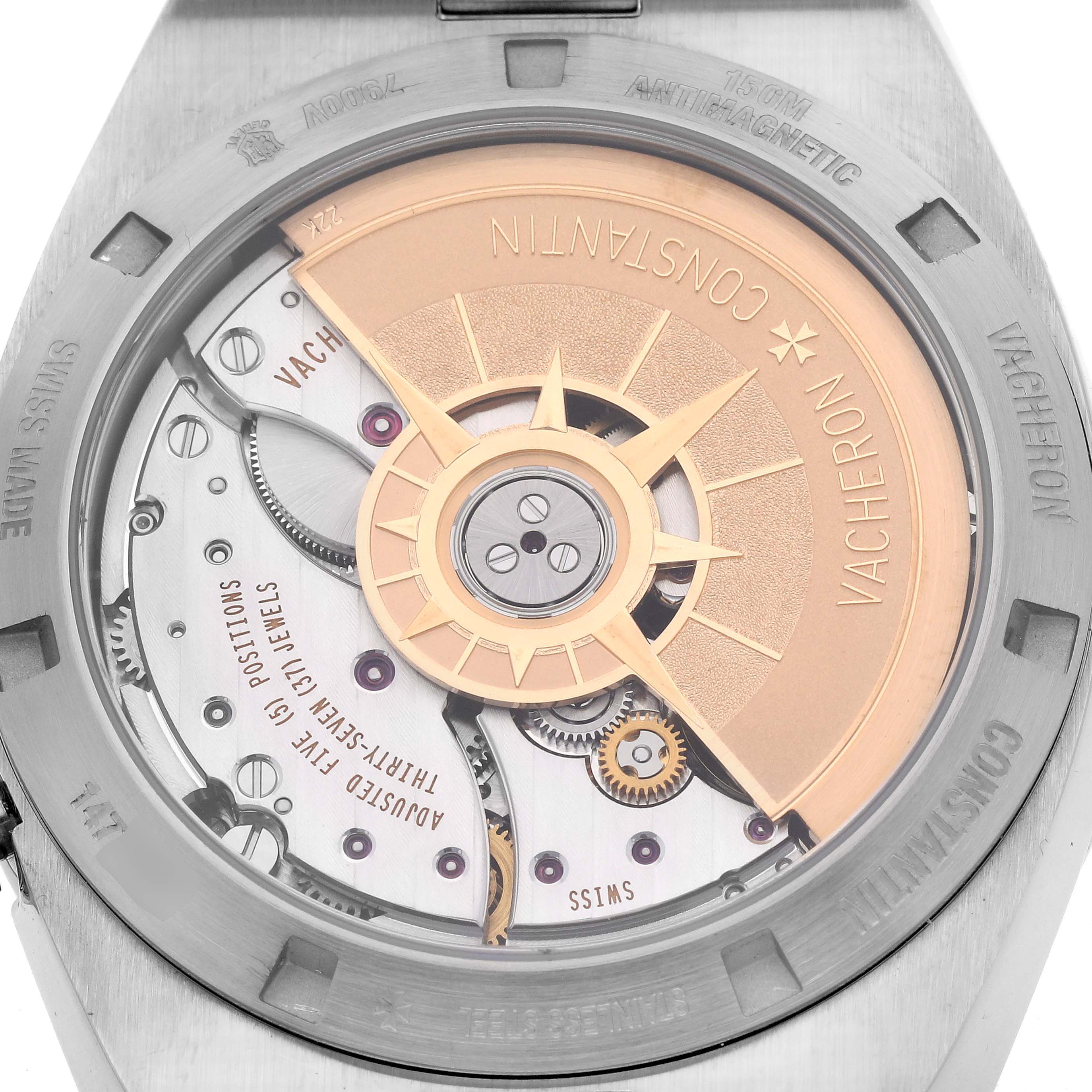 The image shows the back view of a Vacheron Constantin Overseas 7900V/110A-B333 Men's Stainless Steel Silver Dial 7900V/110A-B333 Men's Stainless Steel Silver Dial model, highlighting its intricate movement and rotor design.