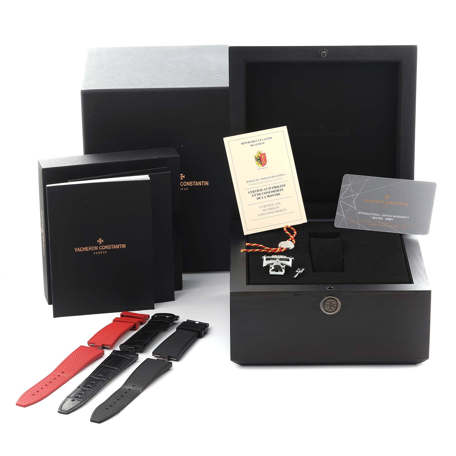 The image shows accessories for the Vacheron Constantin Overseas 7900V/110A-B333 Men's Stainless Steel Silver Dial 7900V/110A-B333 Men's Stainless Steel Silver Dial watch, including straps, a box, documents, and a warranty card.