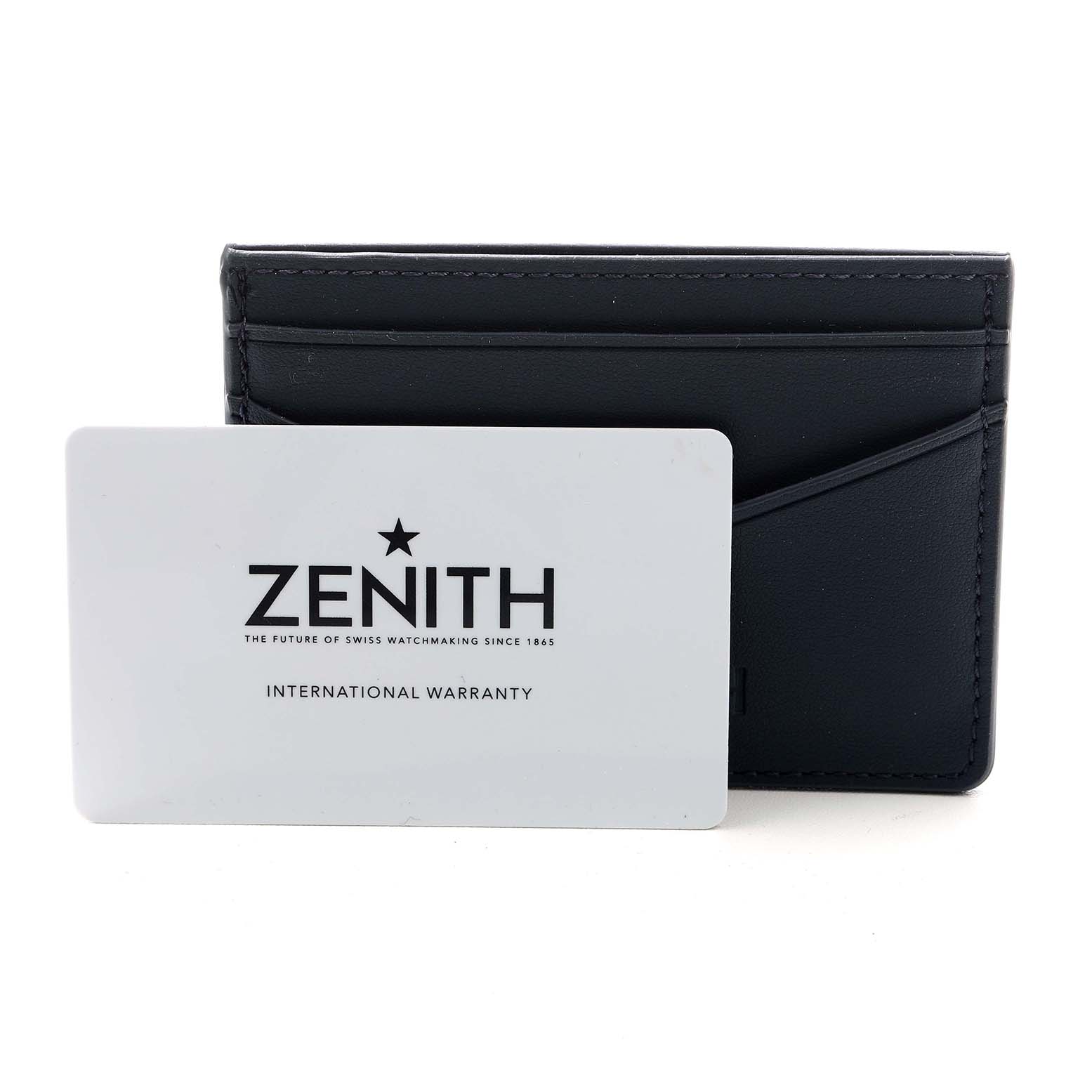 The image shows a Zenith Chronomaster 03.3103.3600/69.M3100 Men's Stainless Steel Silver Dial warranty card and cardholder, viewed from the front.