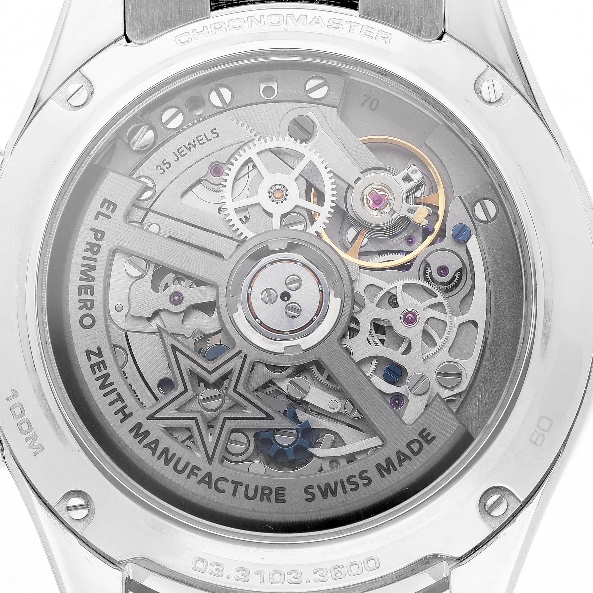 The image shows the backside of a Zenith Chronomaster 03.3103.3600/69.M3100 Men's Stainless Steel Silver Dial, highlighting its intricate movement and open case back.