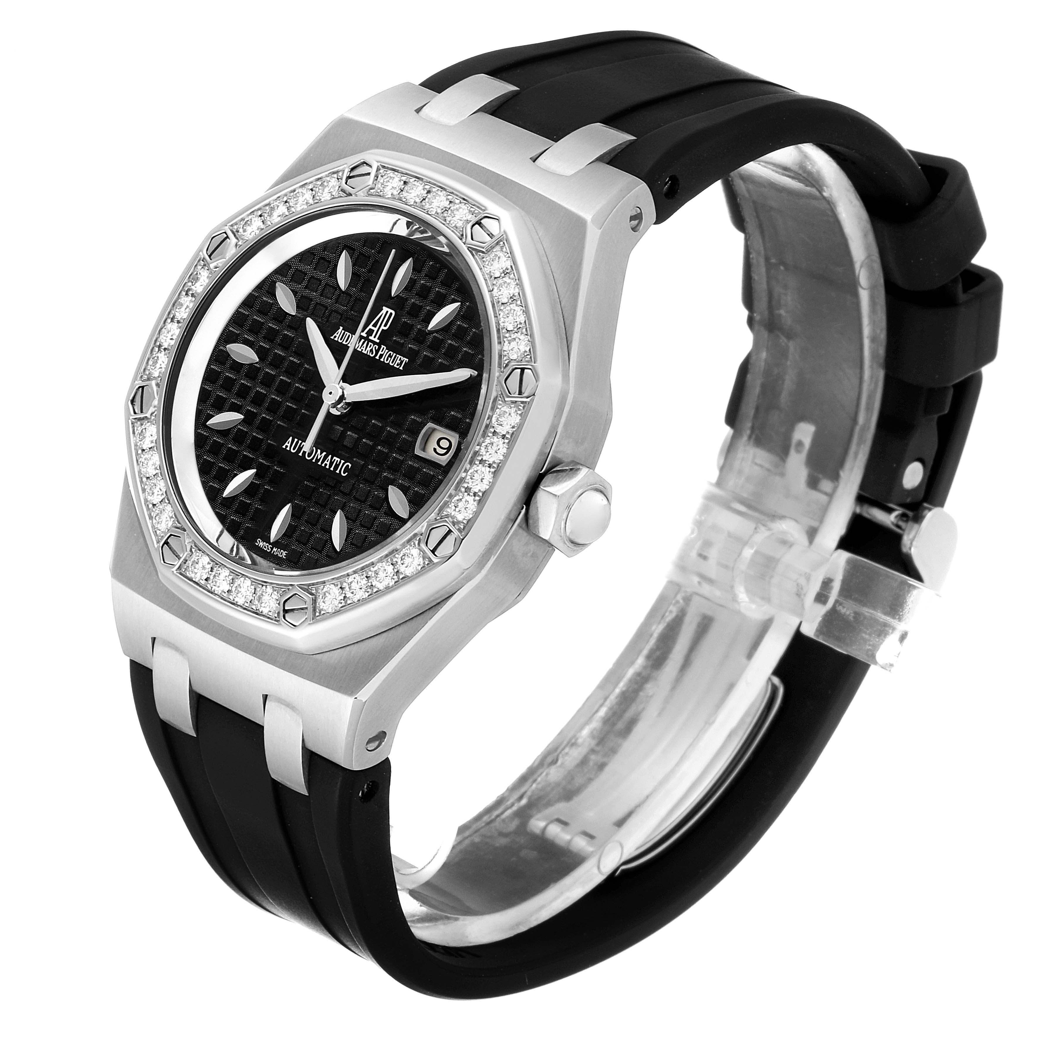 The image shows an Audemars Piguet Royal Oak 77321ST22D002CR01 Women's Stainless Steel Black Dial 77321ST22D002CR01 Women's Stainless Steel Black Dial model at a three-quarter angle, highlighting its black dial, diamond-studded bezel, and black strap.