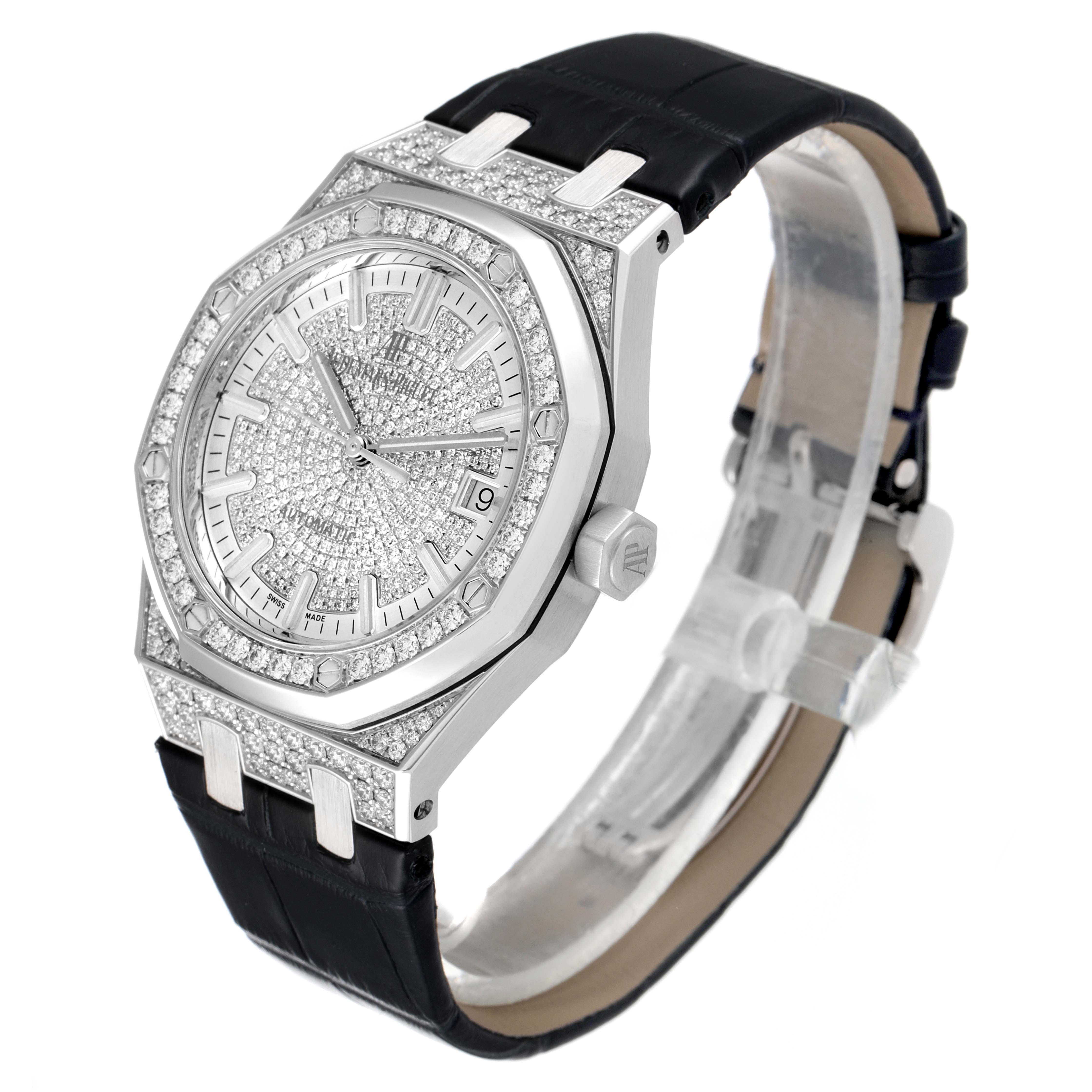 The image shows a side-angle view of an Audemars Piguet Royal Oak 15452BC.ZZ.D019CR.01 Men's White Gold Silver Dial 15452BC.ZZ.D019CR.01 Men's White Gold Silver Dial watch, highlighting its diamond-encrusted dial, bezel, case, and black strap.
