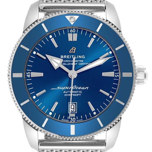 The Breitling Superocean watch is shown from the front, highlighting its blue dial, date window, and rotating bezel.