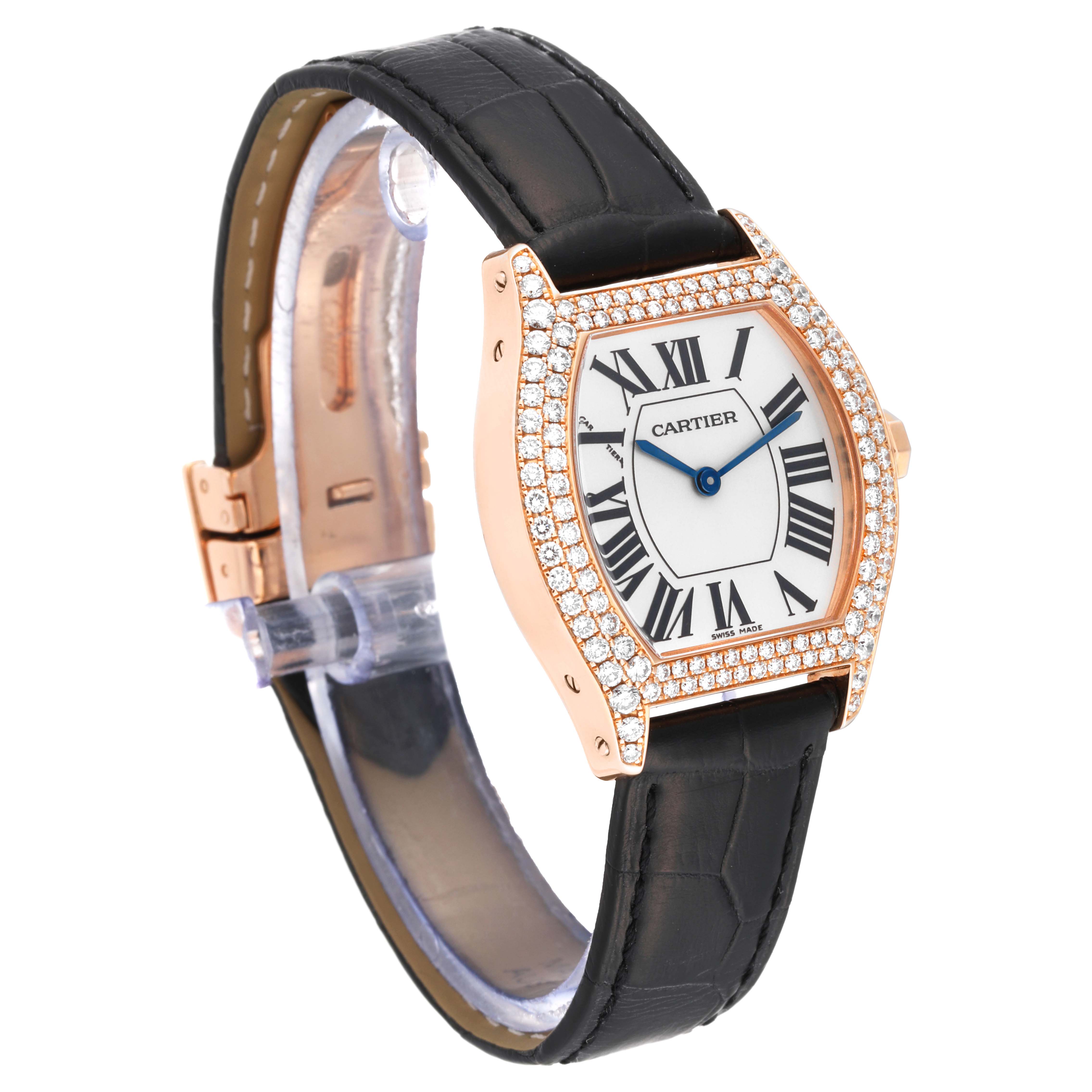 The Cartier Tortue WA505031 Women's Rose Gold Silver Dial WA505031 Women's Rose Gold Silver Dial watch is shown at an oblique angle, detailing its face, bezel with diamonds, and black leather strap.