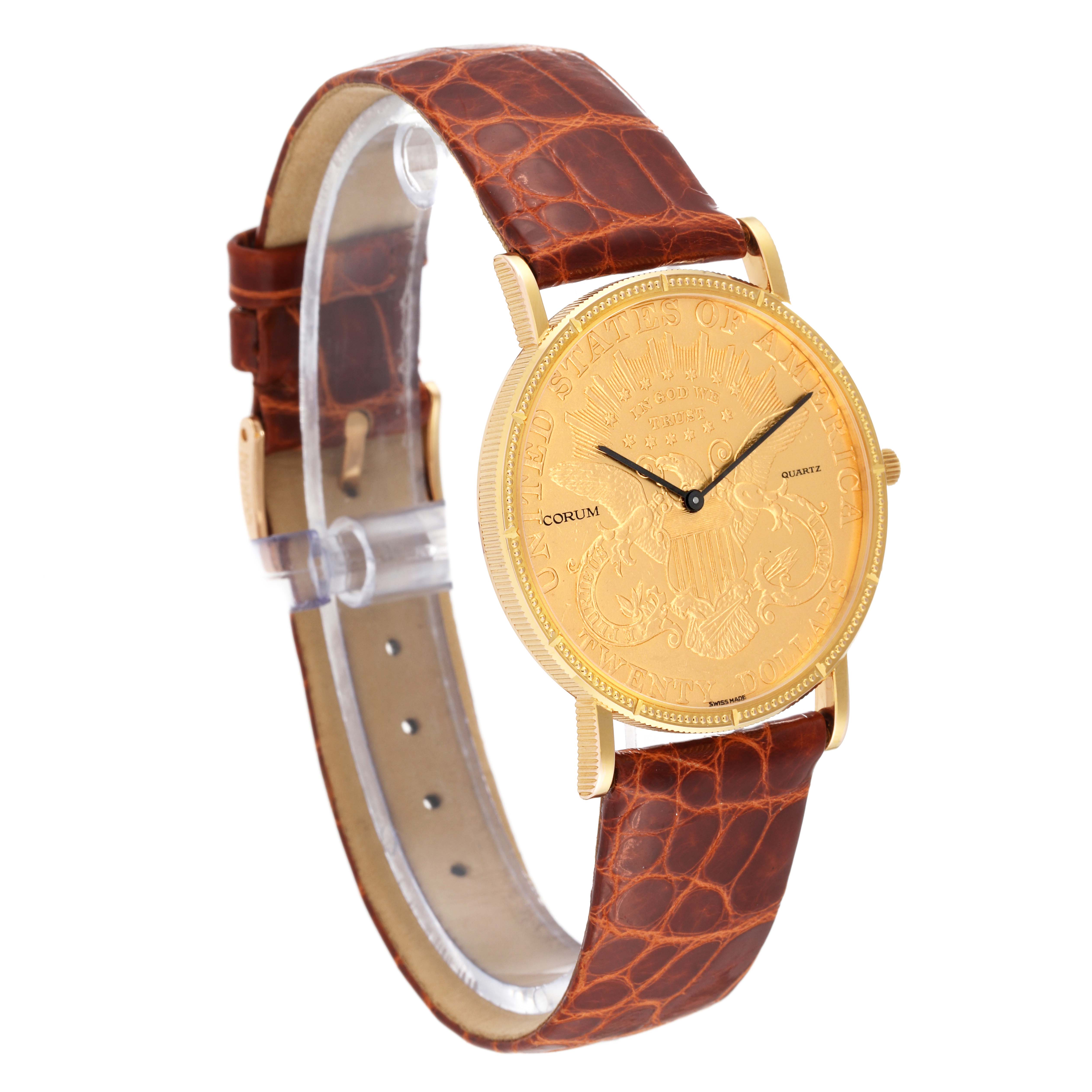 The image shows a side and front angle of the Corum Coin Watch 4708590 Men's Yellow Gold Champagne Dial 4708590 Men's Yellow Gold Champagne Dial model, highlighting its gold face and brown leather strap.