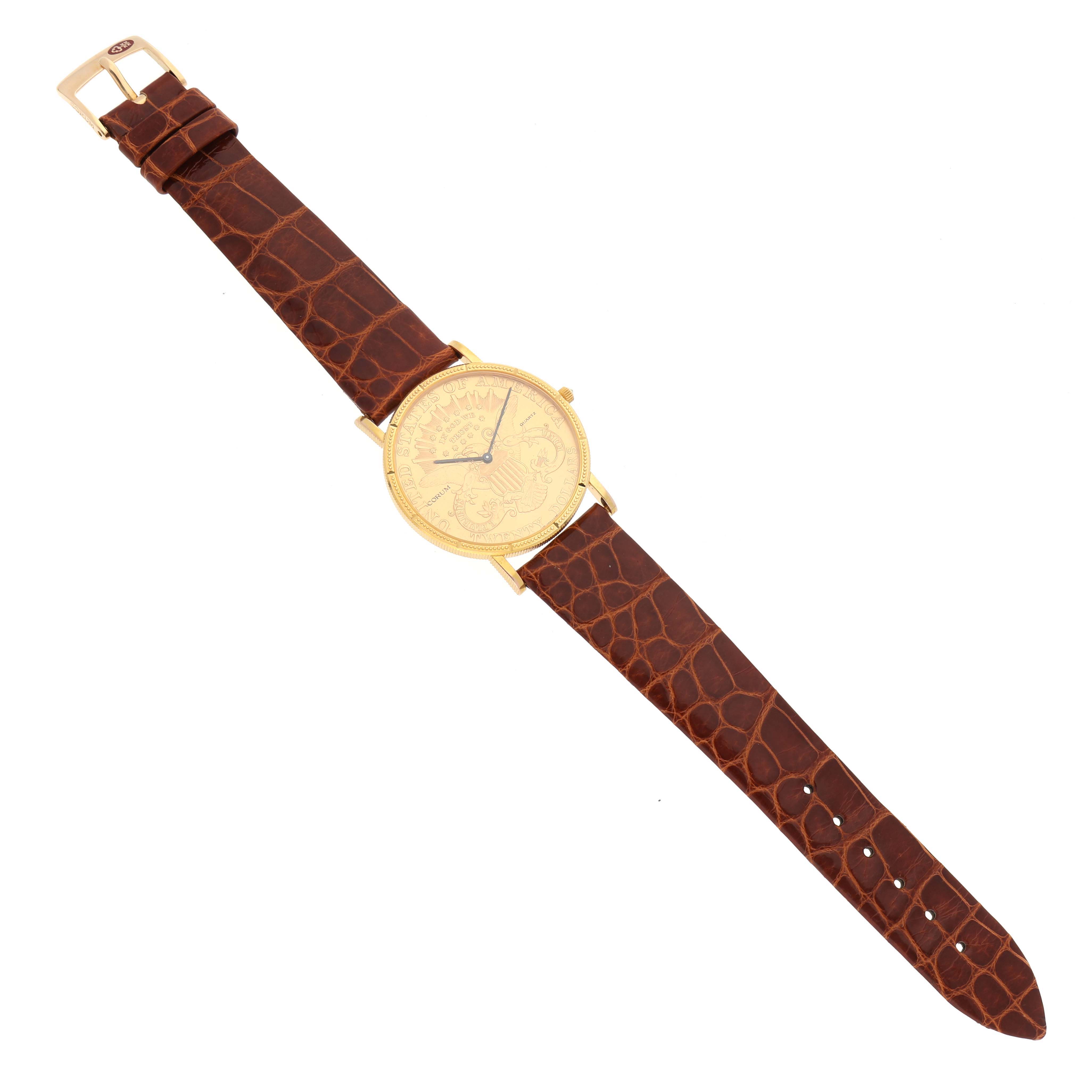 The Corum Coin Watch 4708590 Men's Yellow Gold Champagne Dial 4708590 Men's Yellow Gold Champagne Dial model is shown from a top-down angle, highlighting the watch face, brown leather strap, and gold buckle.