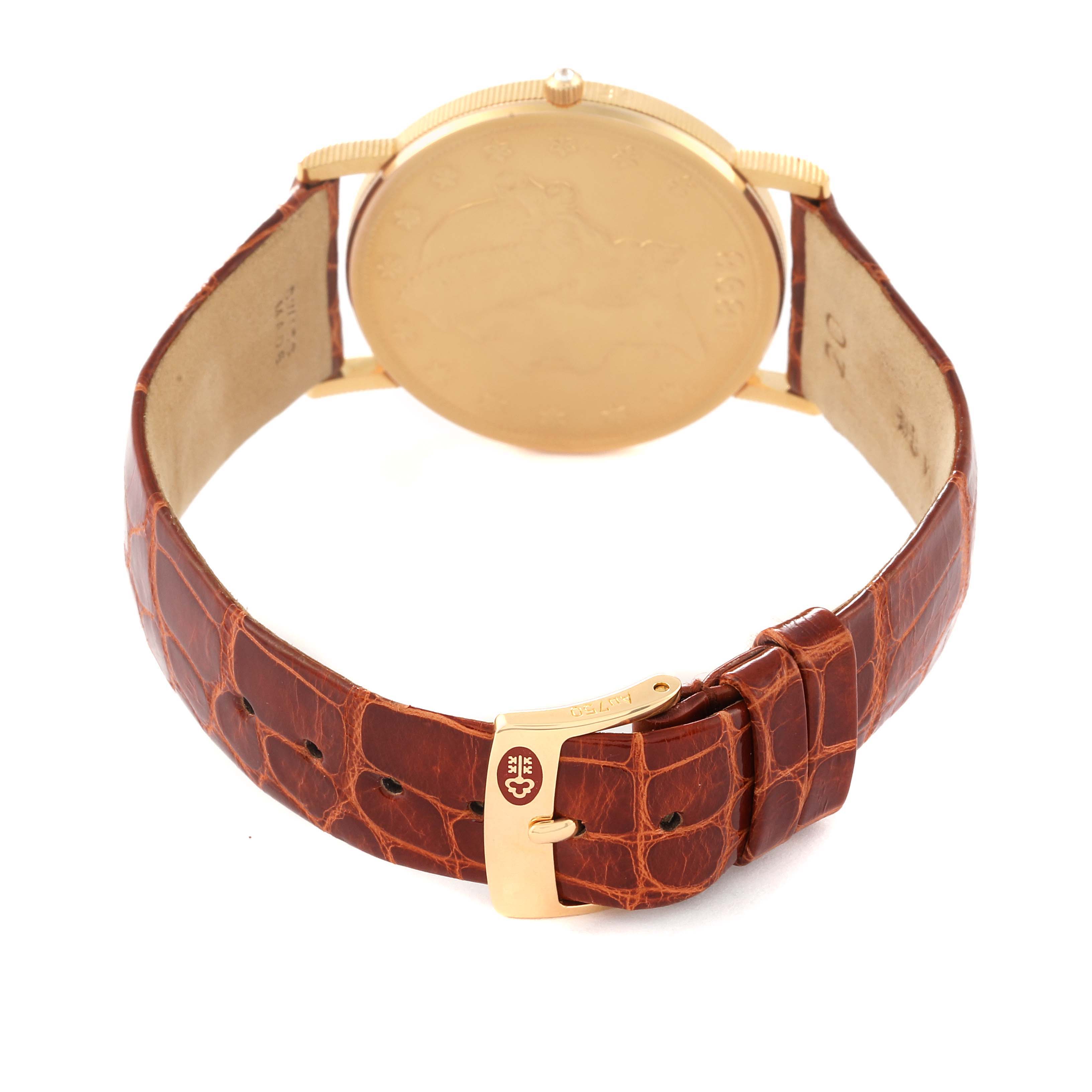 The image shows the Corum Coin Watch 4708590 Men's Yellow Gold Champagne Dial 4708590 Men's Yellow Gold Champagne Dial model from the back, highlighting the case, crown, and leather strap with a buckle.