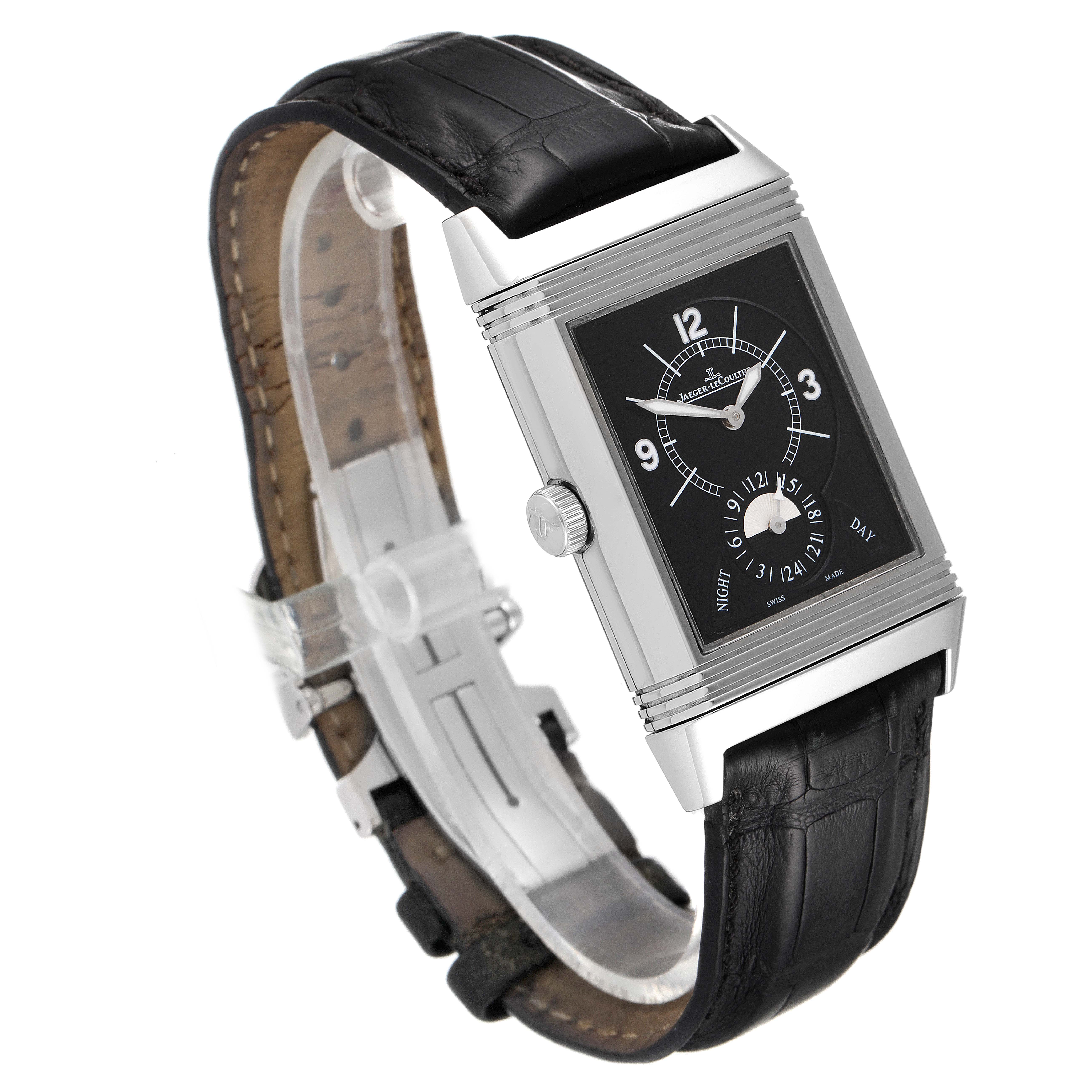 The image shows a Jaeger LeCoultre Reverso Q3748420 Men
s Stainless Steel Silver Dial Q3748420 Men
s Stainless Steel Silver Dial watch at a three-quarter angle, highlighting its black dial, leather strap, and side crown.
