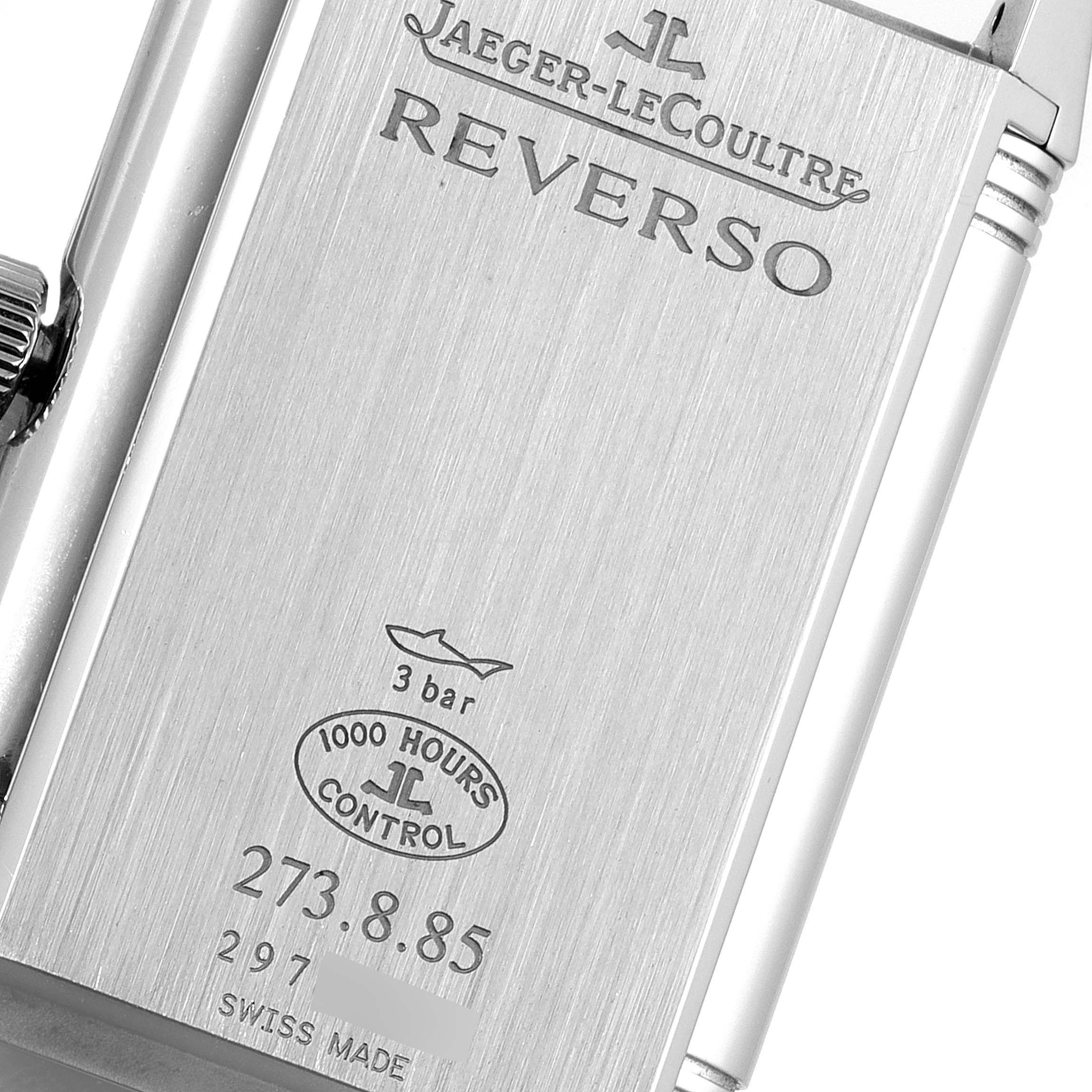 This image shows the case back of a Jaeger-LeCoultre Reverso watch at an angled close-up.
