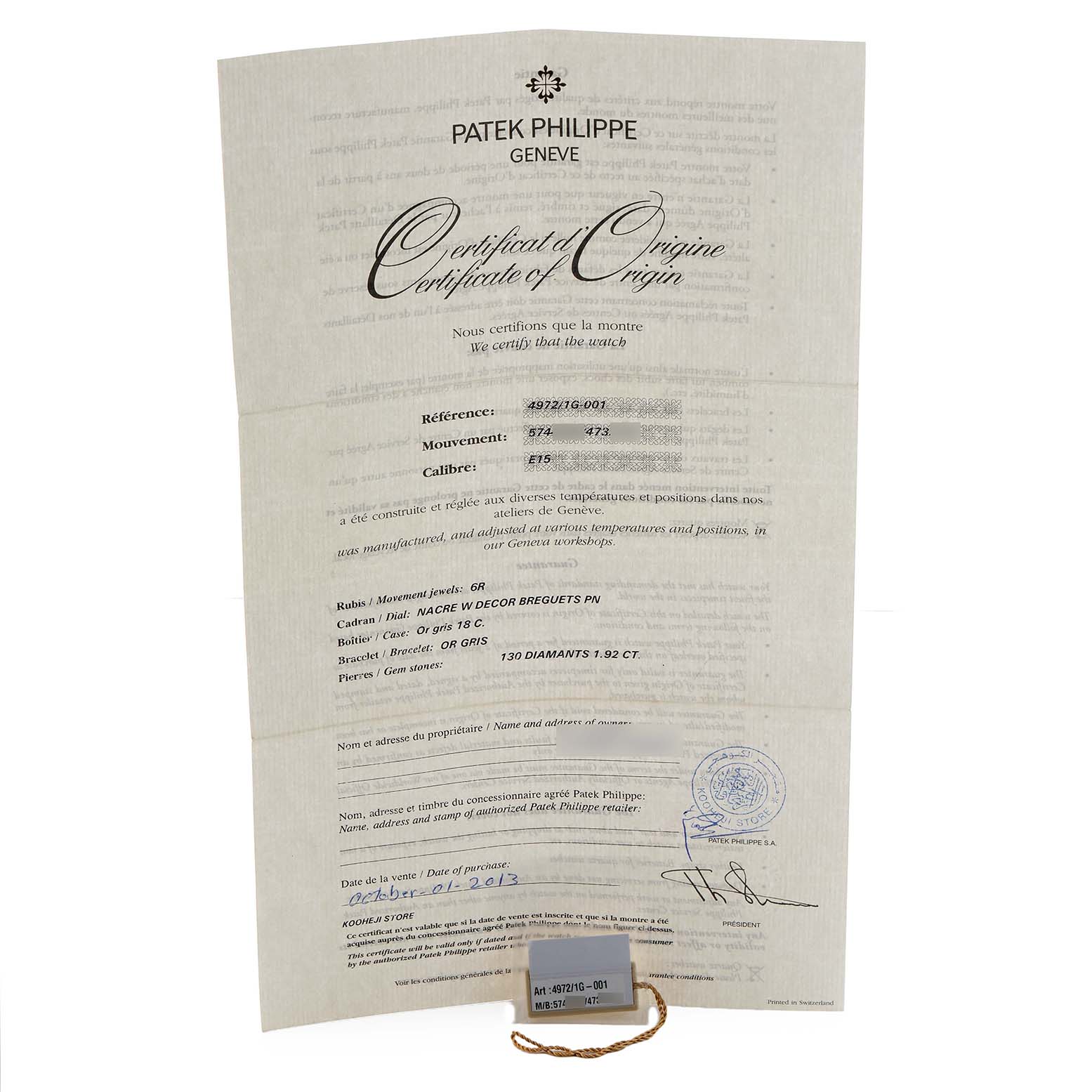 The image shows a Certificate of Origin for the Patek Philippe Gondolo 4972/1G-001 Women's White Gold Mother of Pearl Dial, along with a tag and string.