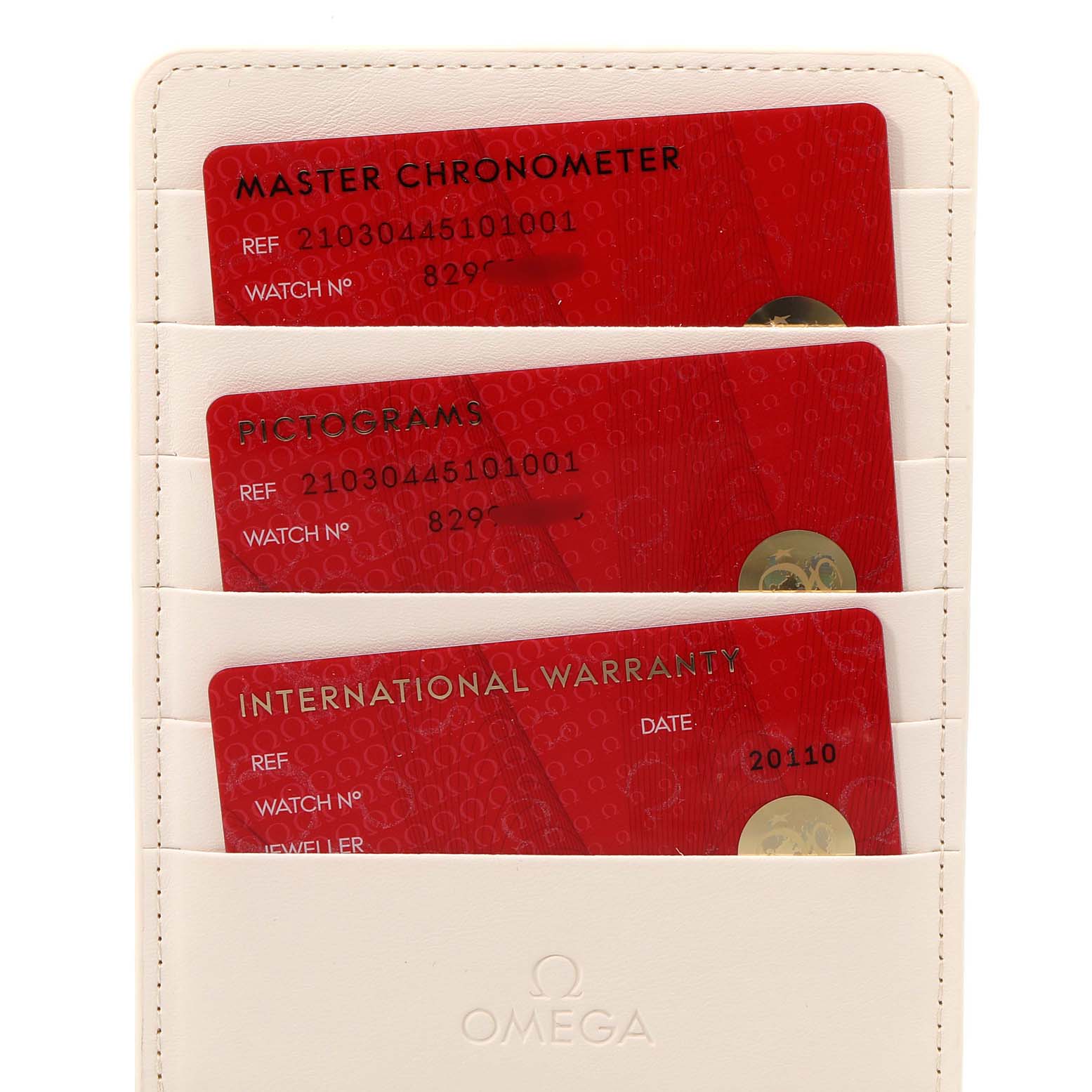 The image shows the warranty and certification cards for an Omega Seamaster 210.30.44.51.01.001 Men's Stainless Steel Black Dial 210.30.44.51.01.001 Men's Stainless Steel Black Dial watch in a holder.