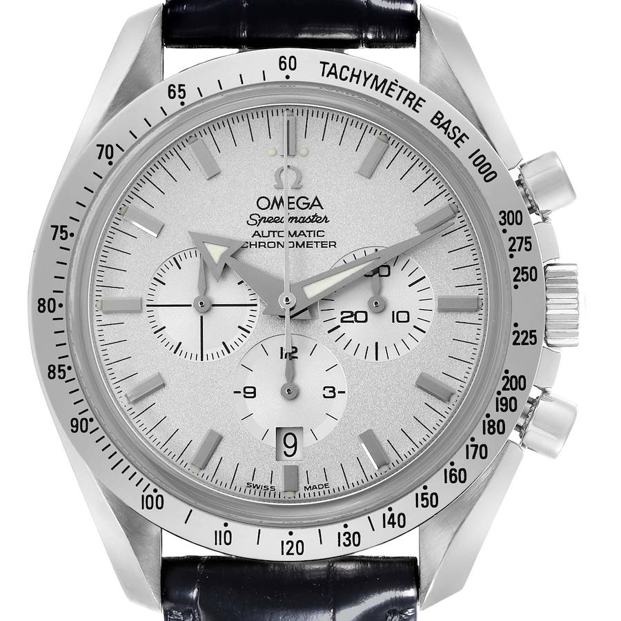 The Omega Speedmaster watch is shown from a front angle, highlighting the dial, bezel, and pushers.