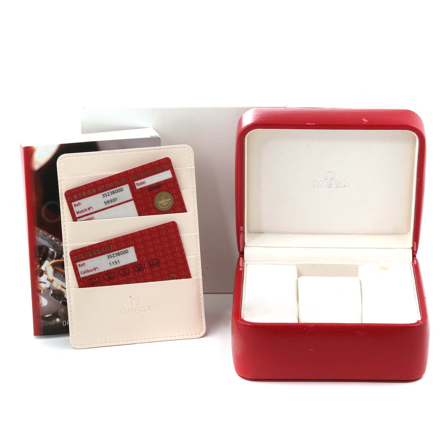 The image shows an Omega Speedmaster 3523.80.00 Men
s Stainless Steel Blue Dial 3523.80.00 Men
s Stainless Steel Blue Dial watch box, warranty cards in a cardholder, and a booklet.