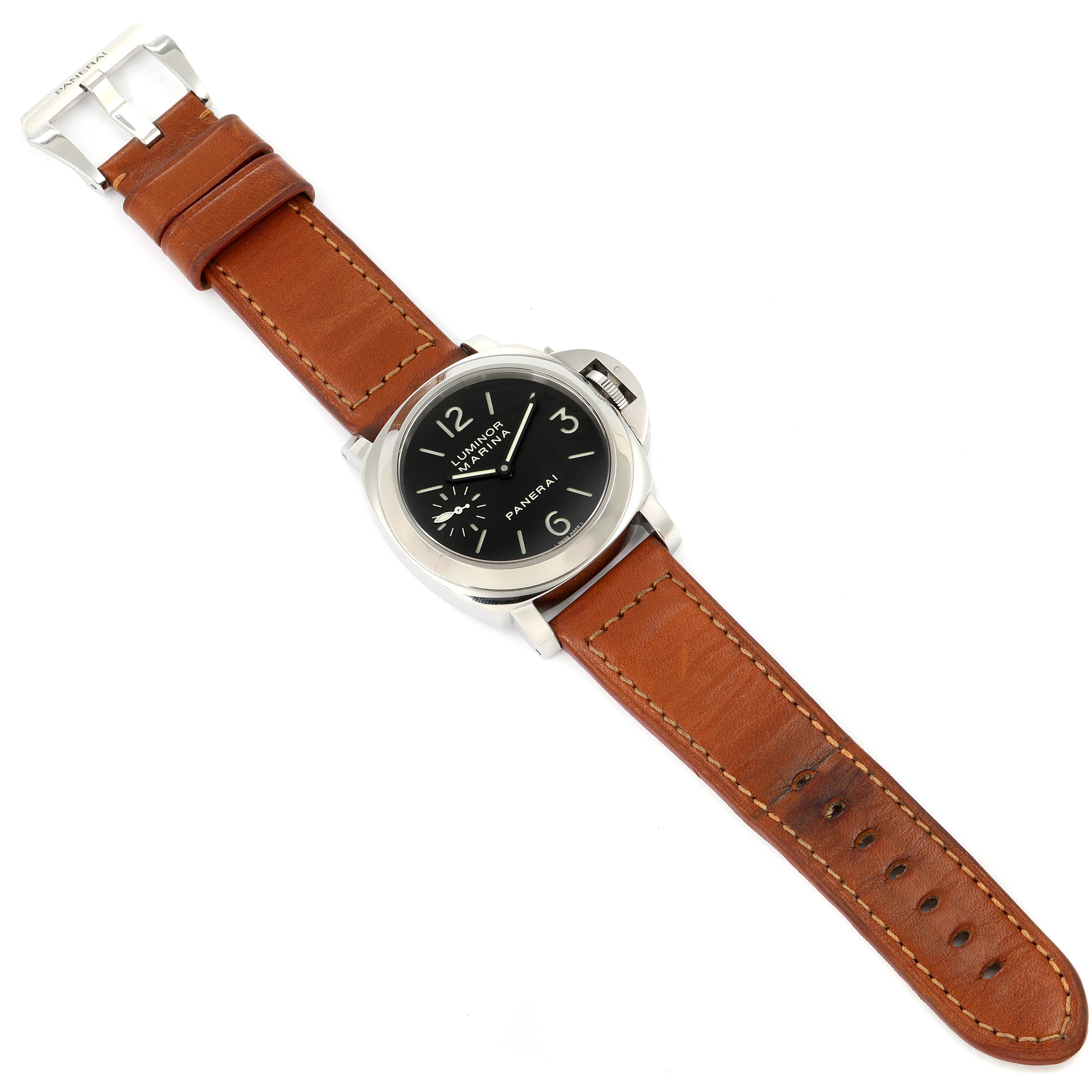 The image shows a Panerai Luminor PAM00111 Men
s Stainless Steel Black Dial PAM00111 Men
s Stainless Steel Black Dial watch from an angled top view, highlighting its brown leather strap and black dial.