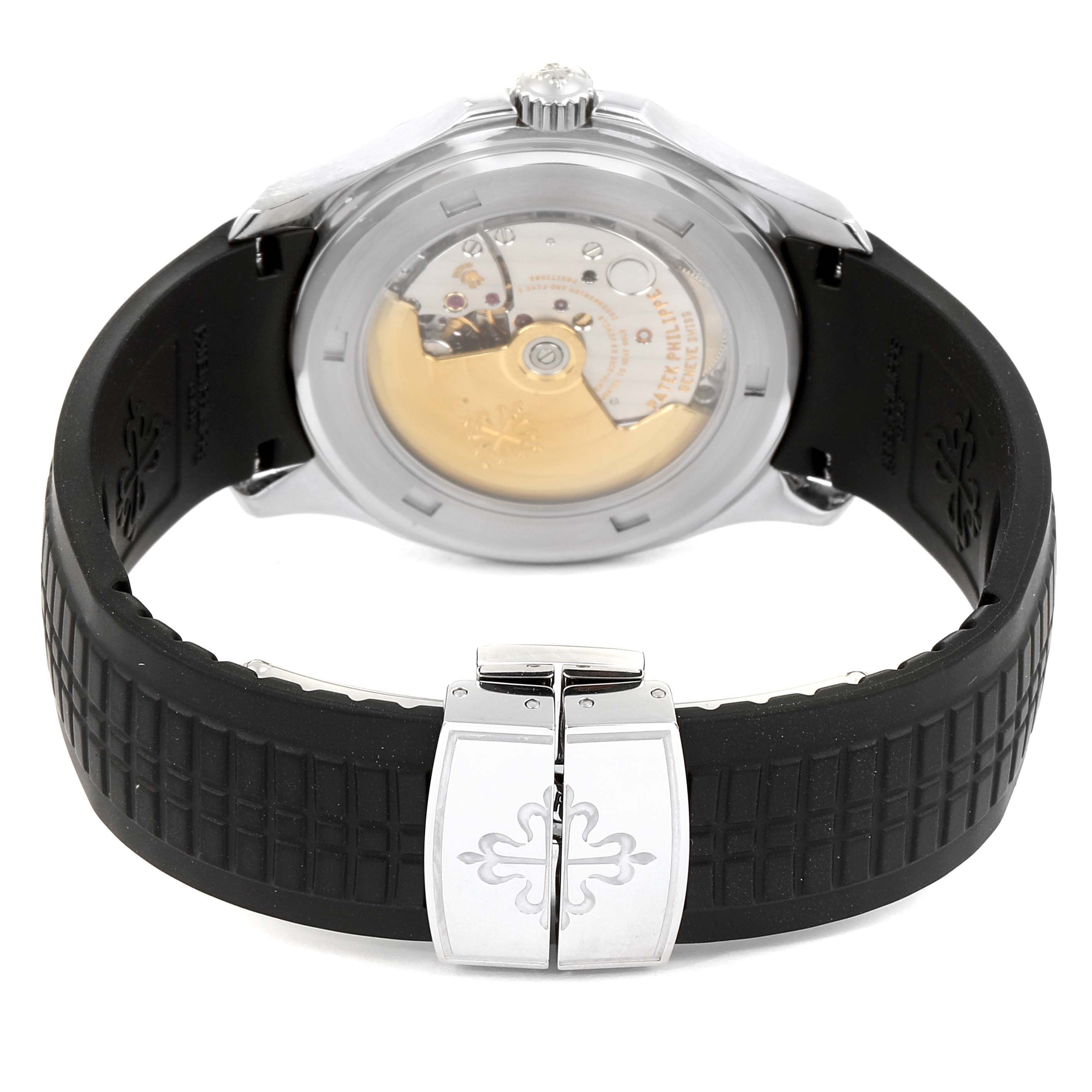 The image shows the back view of a Patek Philippe Aquanaut 5165A-00 Men's Stainless Steel Black Dial 5165A-00 Men's Stainless Steel Black Dial watch, highlighting its transparent case back, movement, and rubber strap.