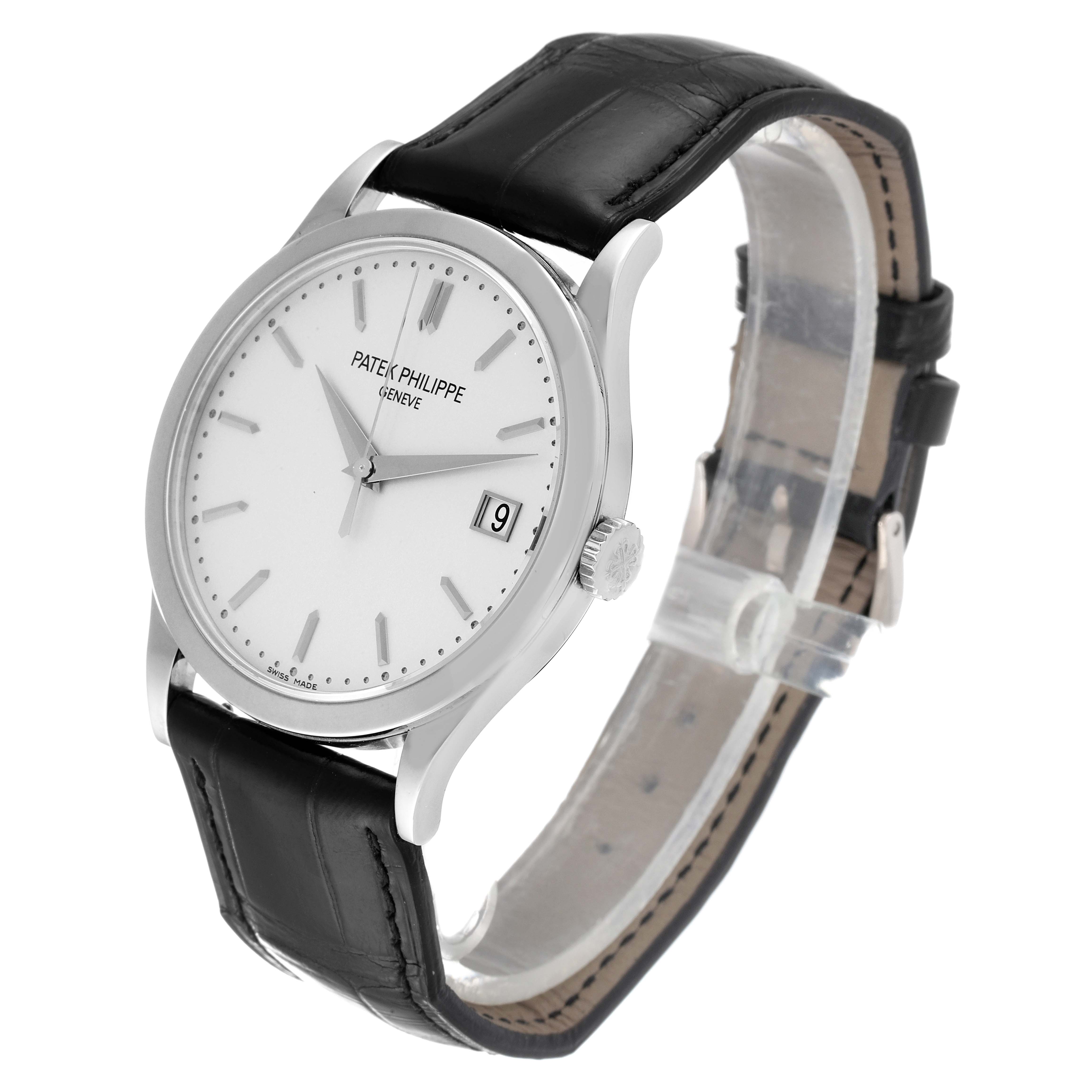 The image shows a Patek Philippe Calatrava 5296G Men's White Gold Silver Dial 5296G Men's White Gold Silver Dial watch at an angle, highlighting its face, crown, and black leather strap.