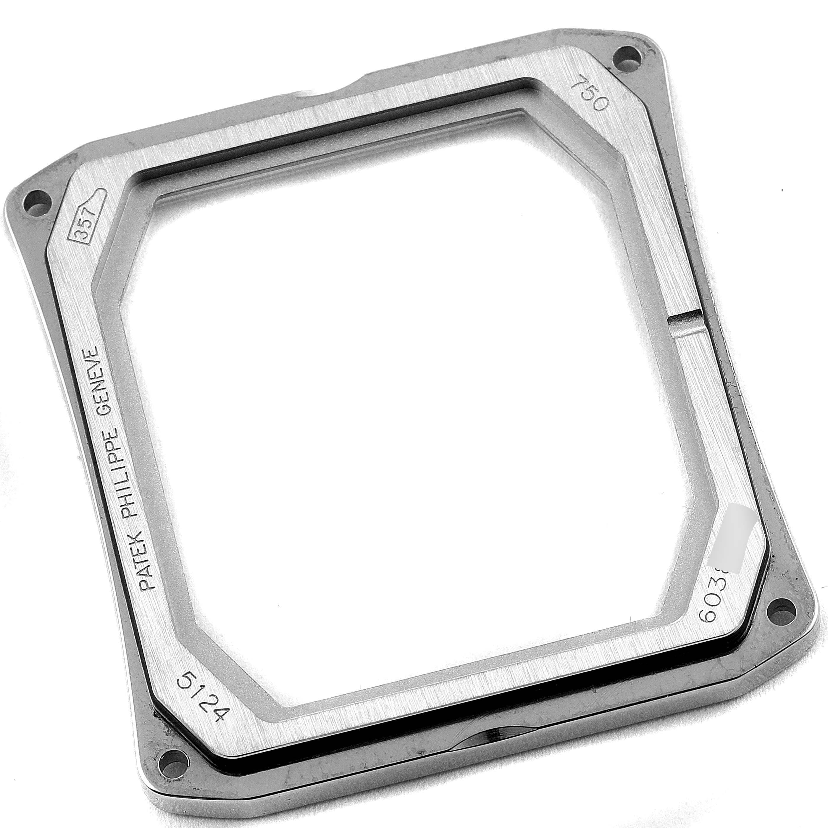 The image shows the bezel of a Patek Philippe Gondolo 5124G Men's White Gold Blue Dial 5124G Men's White Gold Blue Dial watch, viewed from a slightly tilted overhead angle.