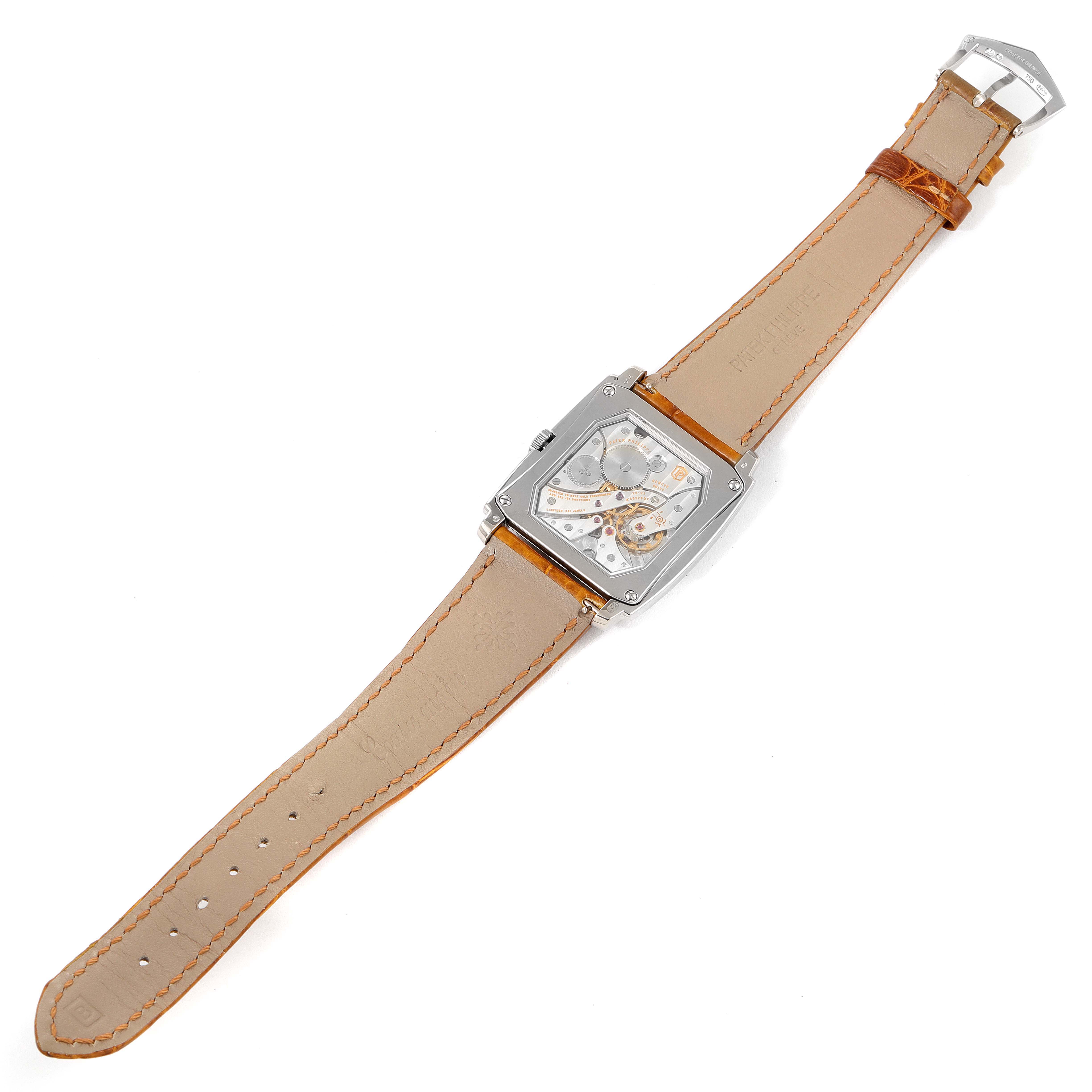 The image shows the back view of a Gondolo model watch by Patek Philippe, highlighting the movement mechanism and leather strap.