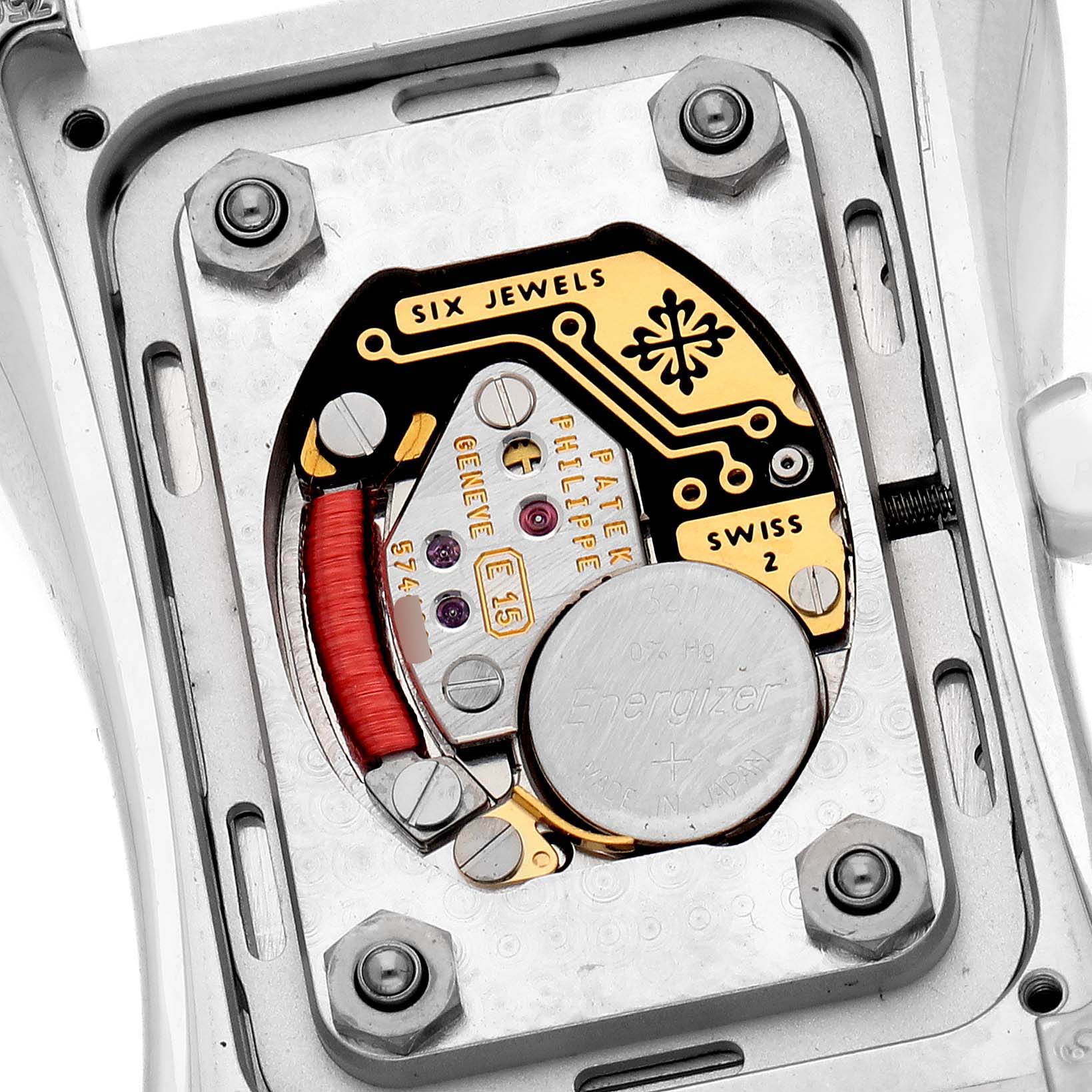 The image shows the back view of a Patek Philippe Gondolo 4972/1G-001 Women's White Gold Mother of Pearl Dial, highlighting the movement and battery compartment.