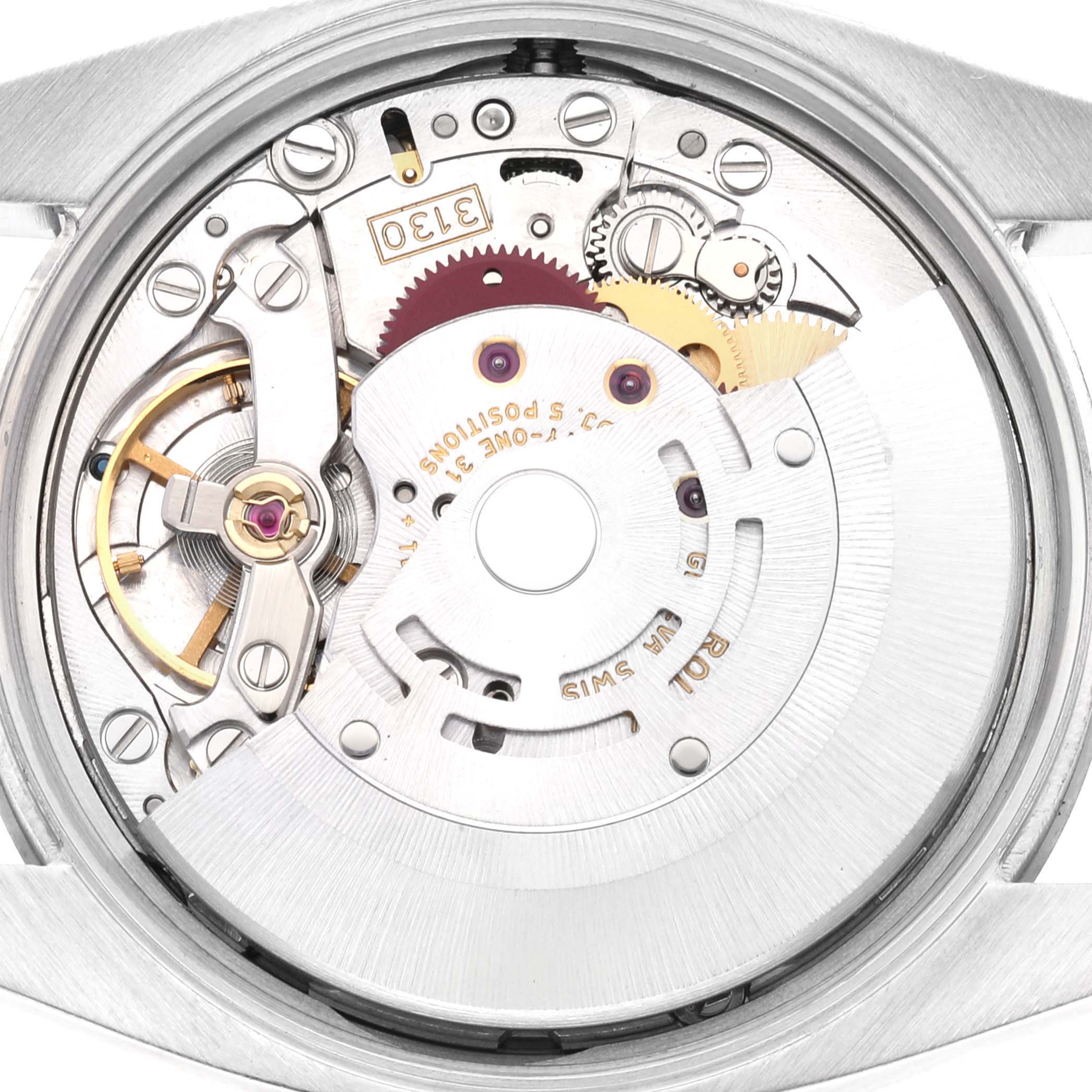 The image shows a close-up view of the Air-King Rolex watch's movement mechanism from the back.