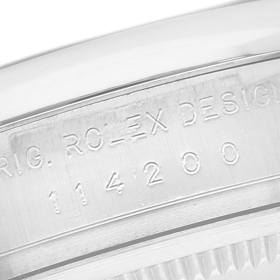 The image shows a close-up of the case side with engravings on the Rolex Air-King 114200 Men's Stainless Steel Silver Dial 114200 Men's Stainless Steel Silver Dial watch.
