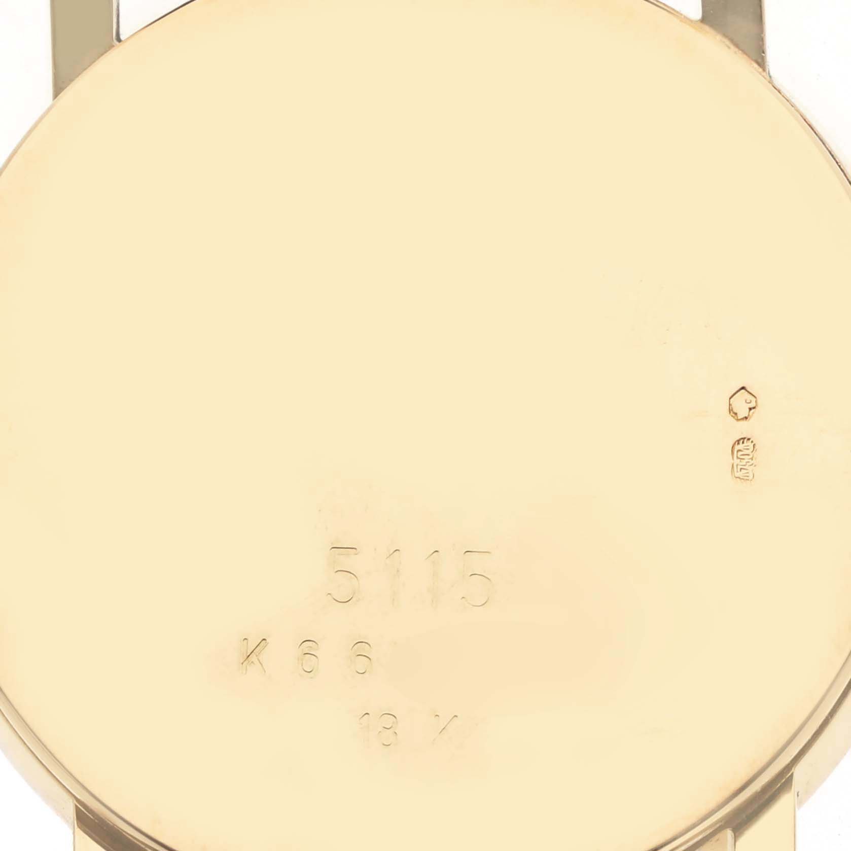 The image shows the back case of a Rolex Cellini 5115 Men's Yellow Gold Silver Dial 5115 Men's Yellow Gold Silver Dial watch, emphasizing its markings and gold finish.