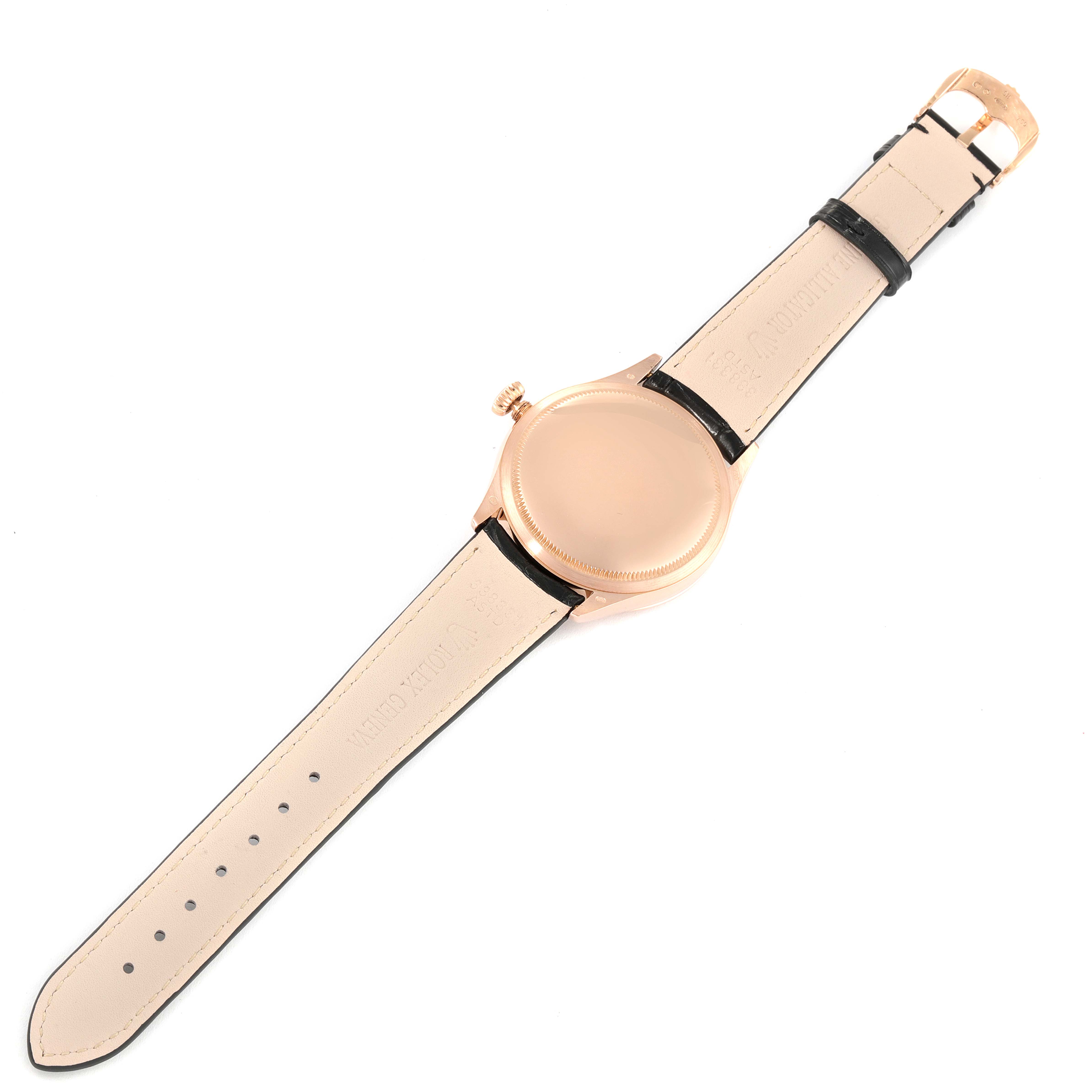 This image shows the back view of a Rolex Cellini 50505 Men's Rose Gold Black Dial 50505 Men's Rose Gold Black Dial watch with its leather strap fully extended.