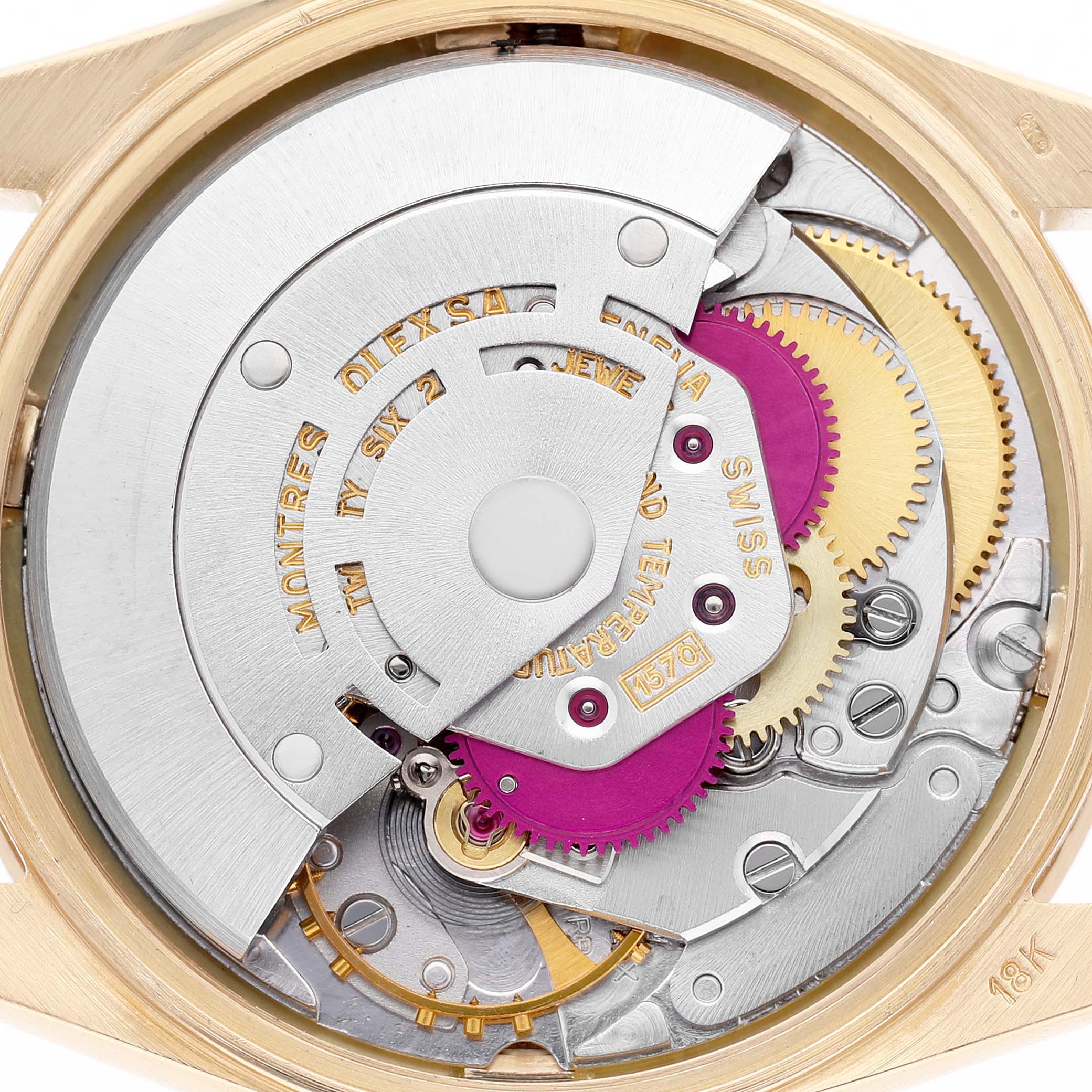 The image shows the movement of a Rolex Date 1501 Men's Yellow Gold Silver Dial model watch from a rear angle, highlighting gears and the rotor.