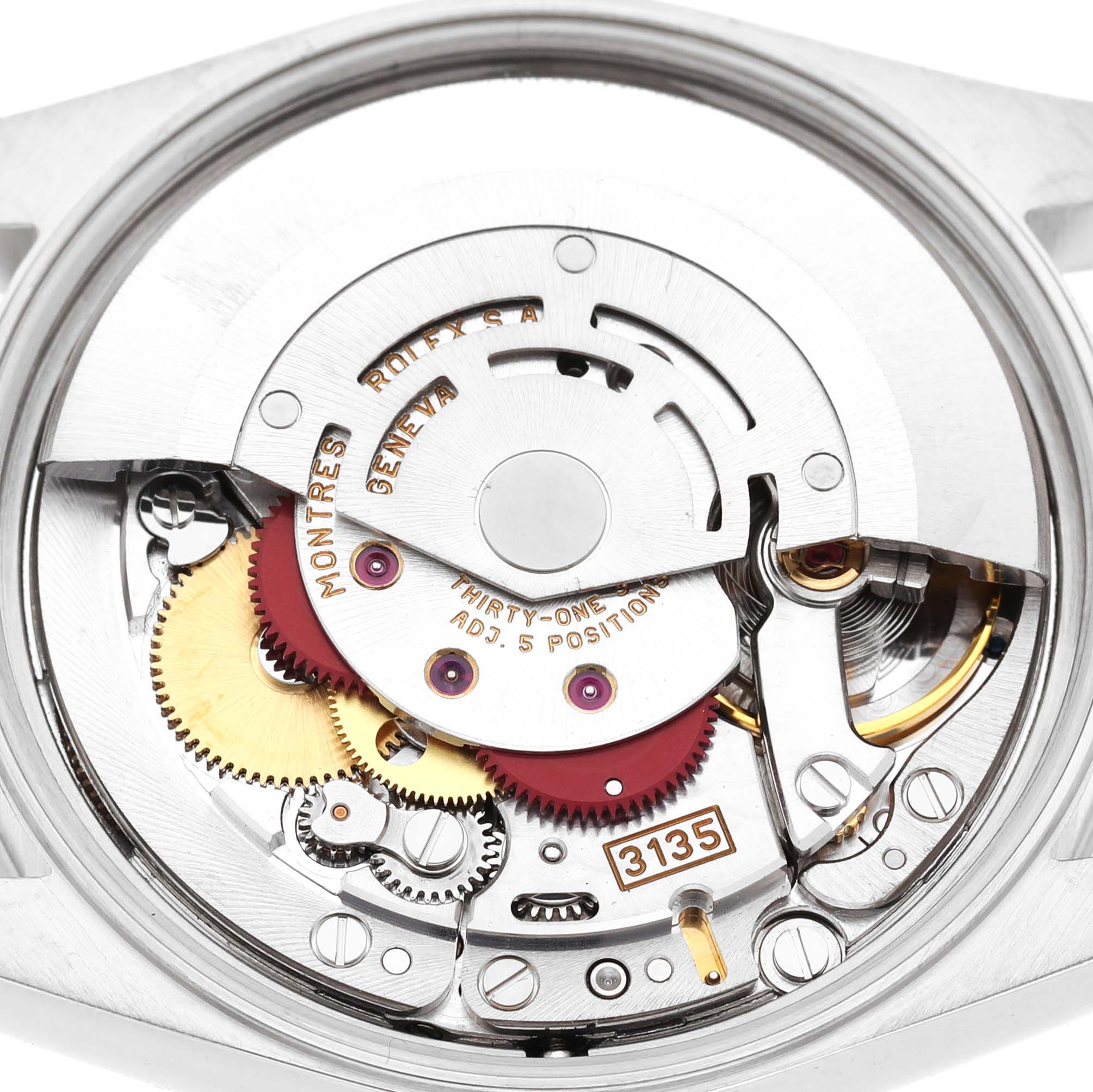 The image shows the movement of a Rolex Date 15200 Men's Stainless Steel White Dial model watch, focusing on its intricate internal components.