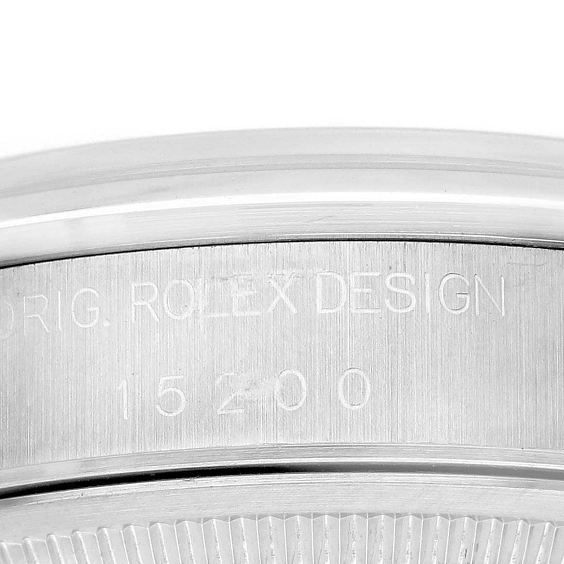 The image shows a close-up of the side engraving on a Rolex Date 15200 Men's Stainless Steel White Dial model watch, focusing on the case edge and design markings.