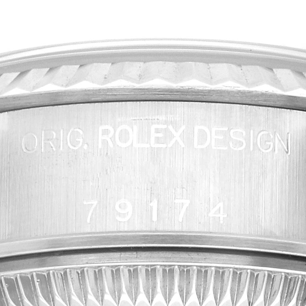 This close-up image shows the engraved case side of a Rolex Datejust 79174 Women's Stainless Steel Black Dial 79174 Women's Stainless Steel Black Dial watch, highlighting the model number "79174" and design details.