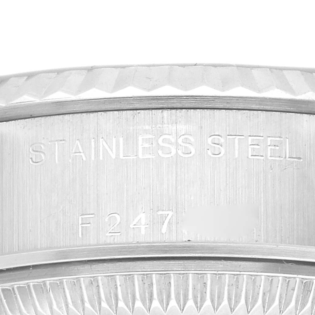 This close-up image shows the stainless steel case with model engraving of a Rolex Datejust 79174 Women's Stainless Steel Black Dial 79174 Women's Stainless Steel Black Dial watch.