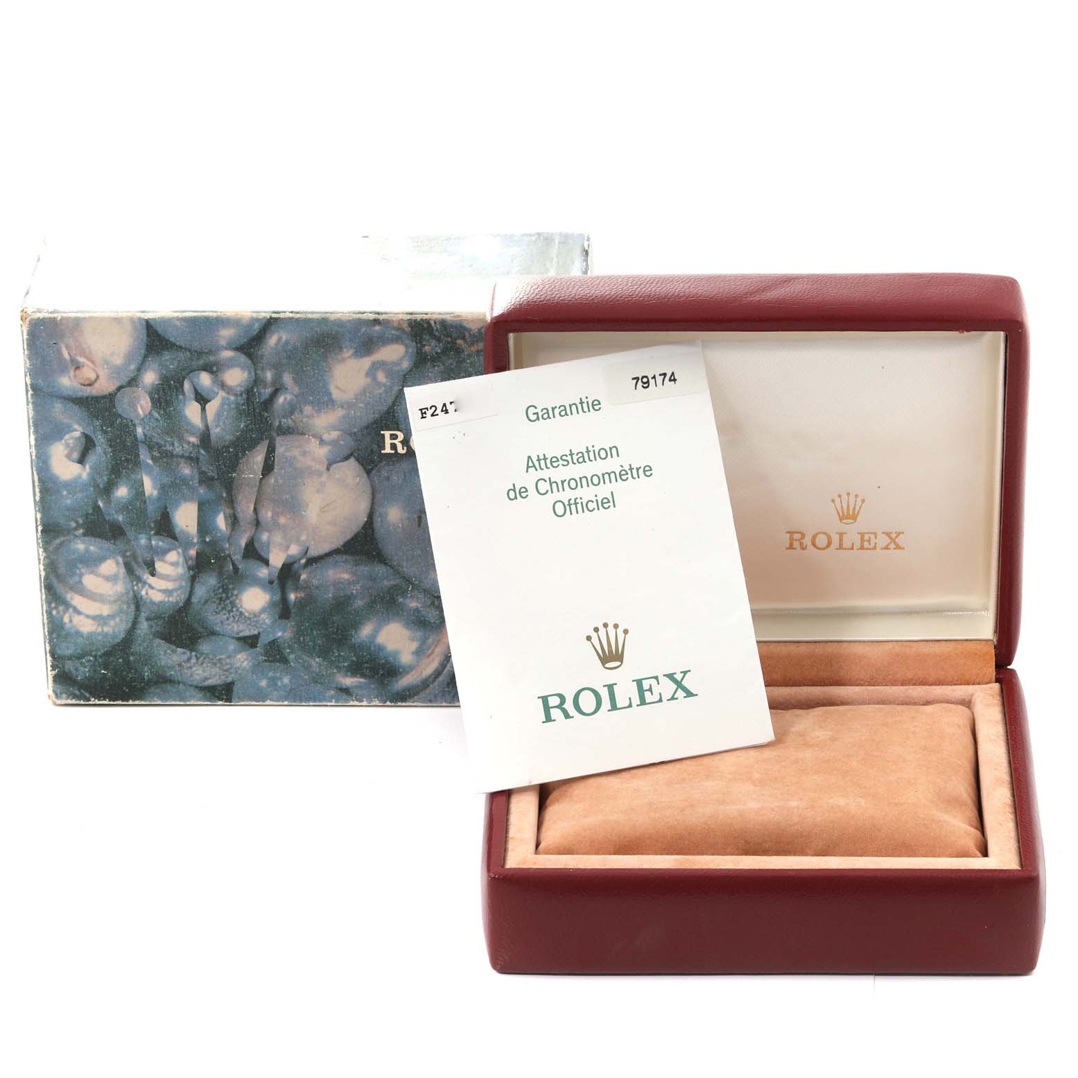 This image shows a Rolex Datejust 79174 Women's Stainless Steel Black Dial 79174 Women's Stainless Steel Black Dial watch box, an outer box, and official warranty papers.