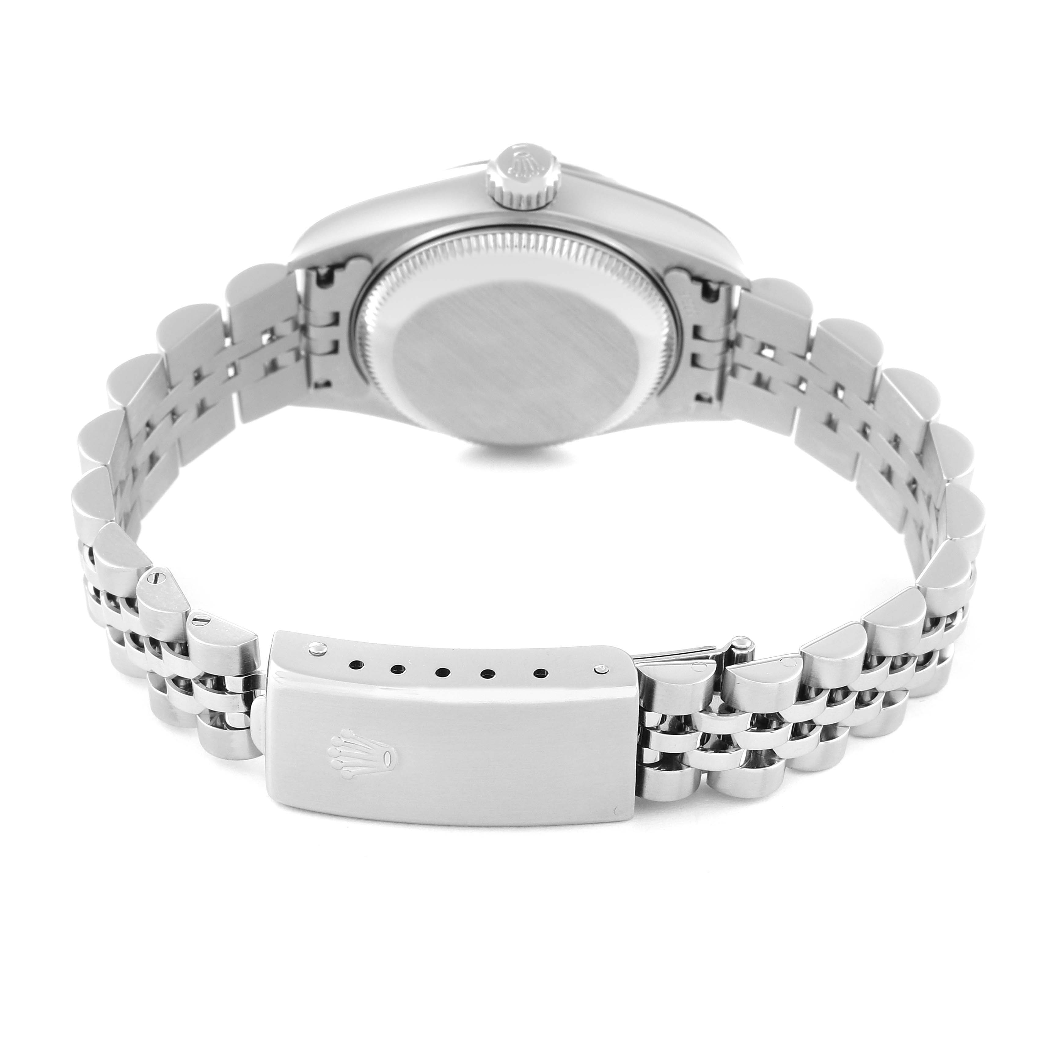 The image shows the back view of a Rolex Datejust 79174 Women's Stainless Steel Black Dial 79174 Women's Stainless Steel Black Dial watch, highlighting the case back, crown, and bracelet with a clasp.