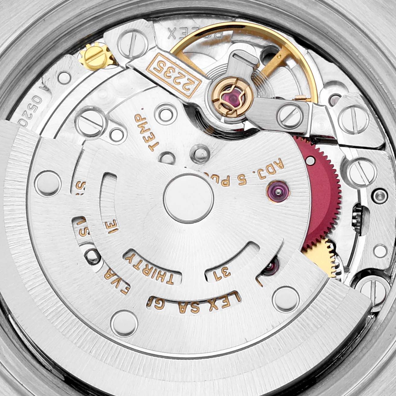 The image shows a close-up view of the Rolex Datejust 79174 Women's Stainless Steel Silver Dial 79174 Women's Stainless Steel Silver Dial's movement mechanism, highlighting its intricate internal components.